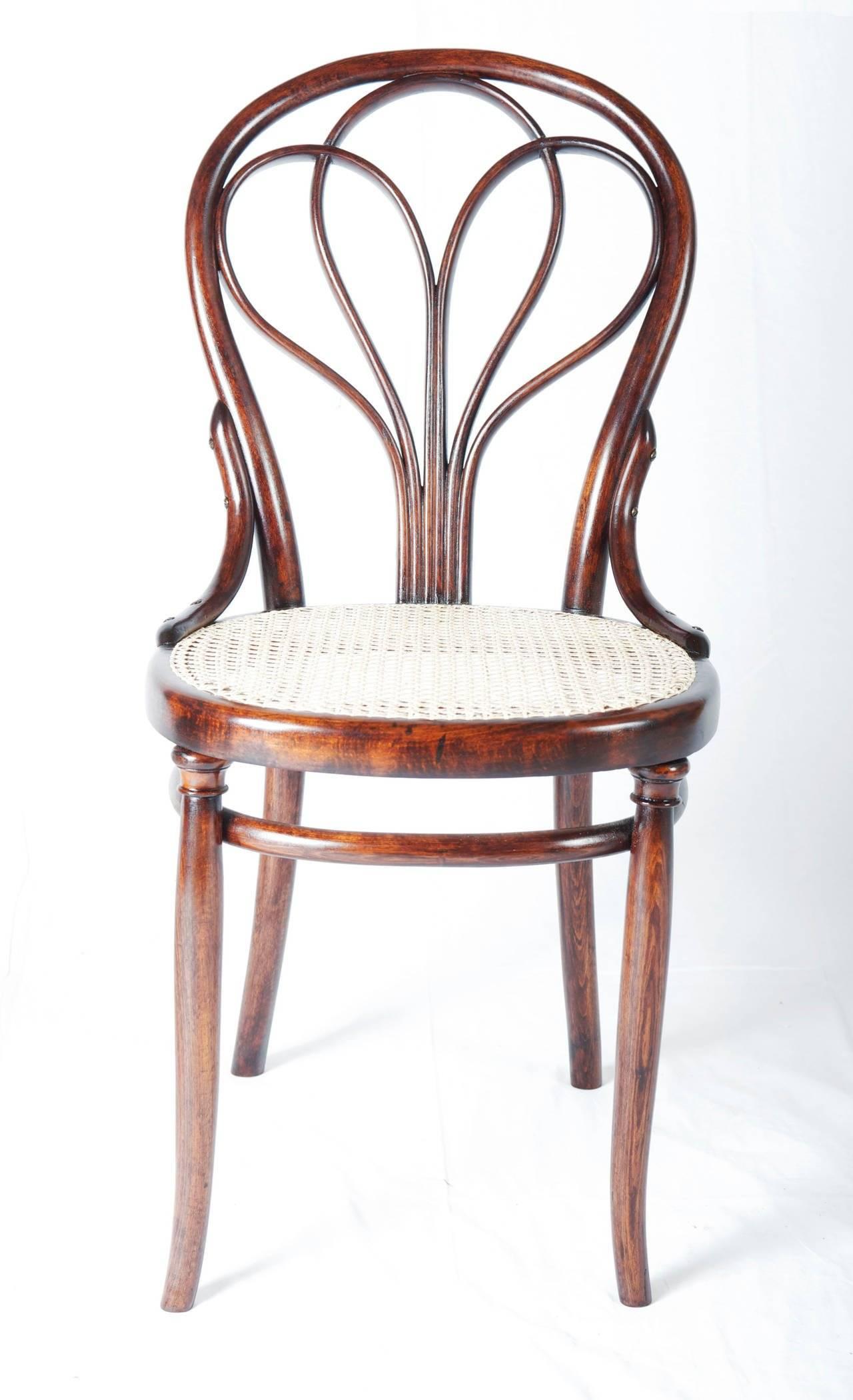 Thonet no. 25 chairs with original bentwood frame in walnut stained beech with new caned seat. 
Signed 