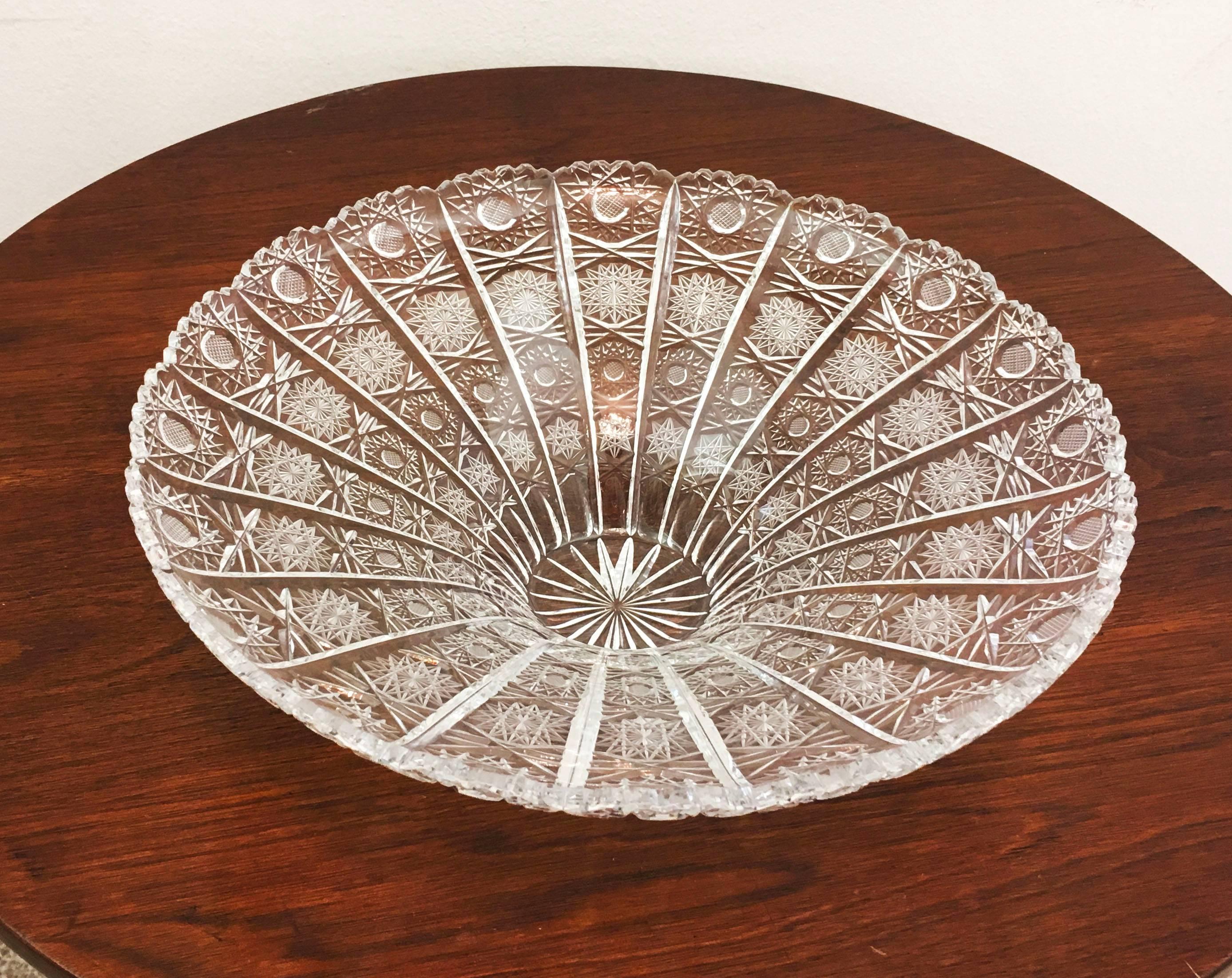 Extravagant cut and polished crystal bowl made circa the 1970s in one of the Bohemian glass works. The cutting is especially Fine and deep with the very intricate patterns. Designed to be used for the centre table.