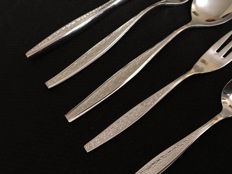 Austrian high-quality flatware by Berndorf, former Krupp company, model Flamenco from the 1970s. The cutlery has a handle with the very interesting geometric decor. Used but in excellent condition, some in near new condition.

30 pieces are in