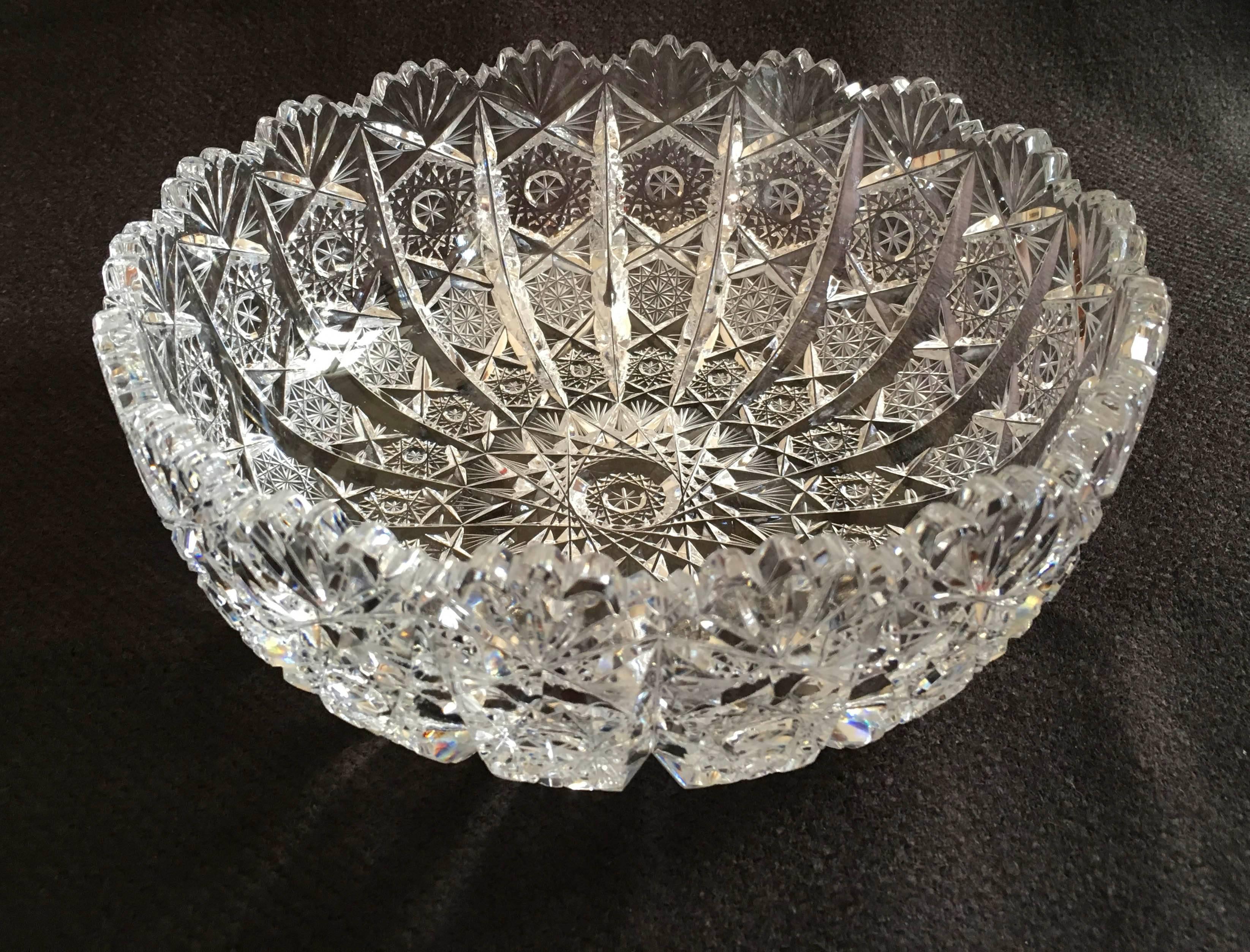 Extravagant cut and polished crystal bowl made circa the 1970s in one of the Bohemian glass works. The cutting is especially Fine and deep with the very intricate patterns. 