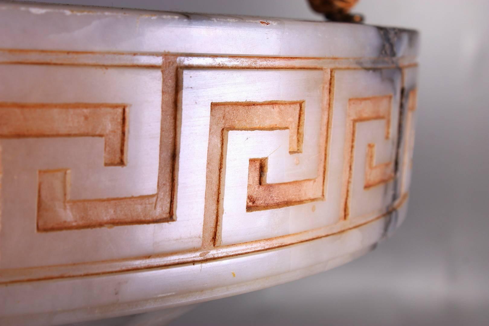 Alabaster shade with the engraved Greek decor and fitted with four E27 sockets. Made in France in the 1930s.