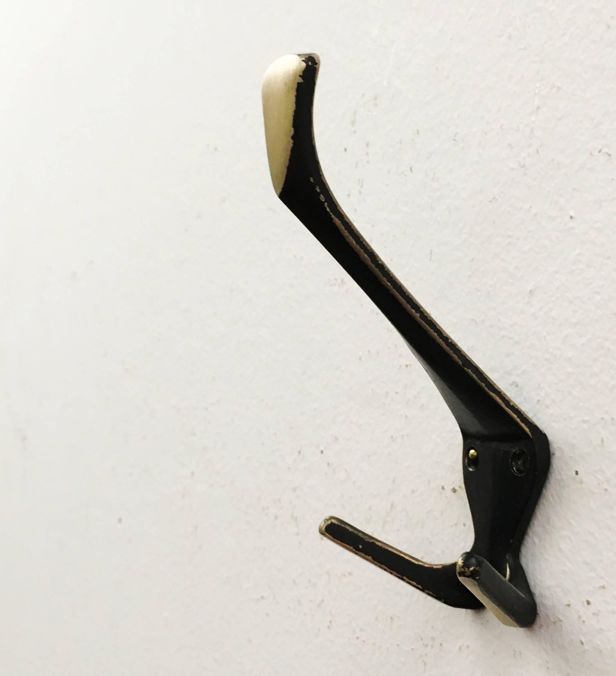 Ebonized brass coat, hat hooks, elegant shape and perfect quality from the 1950s.
Up to five pieces available.