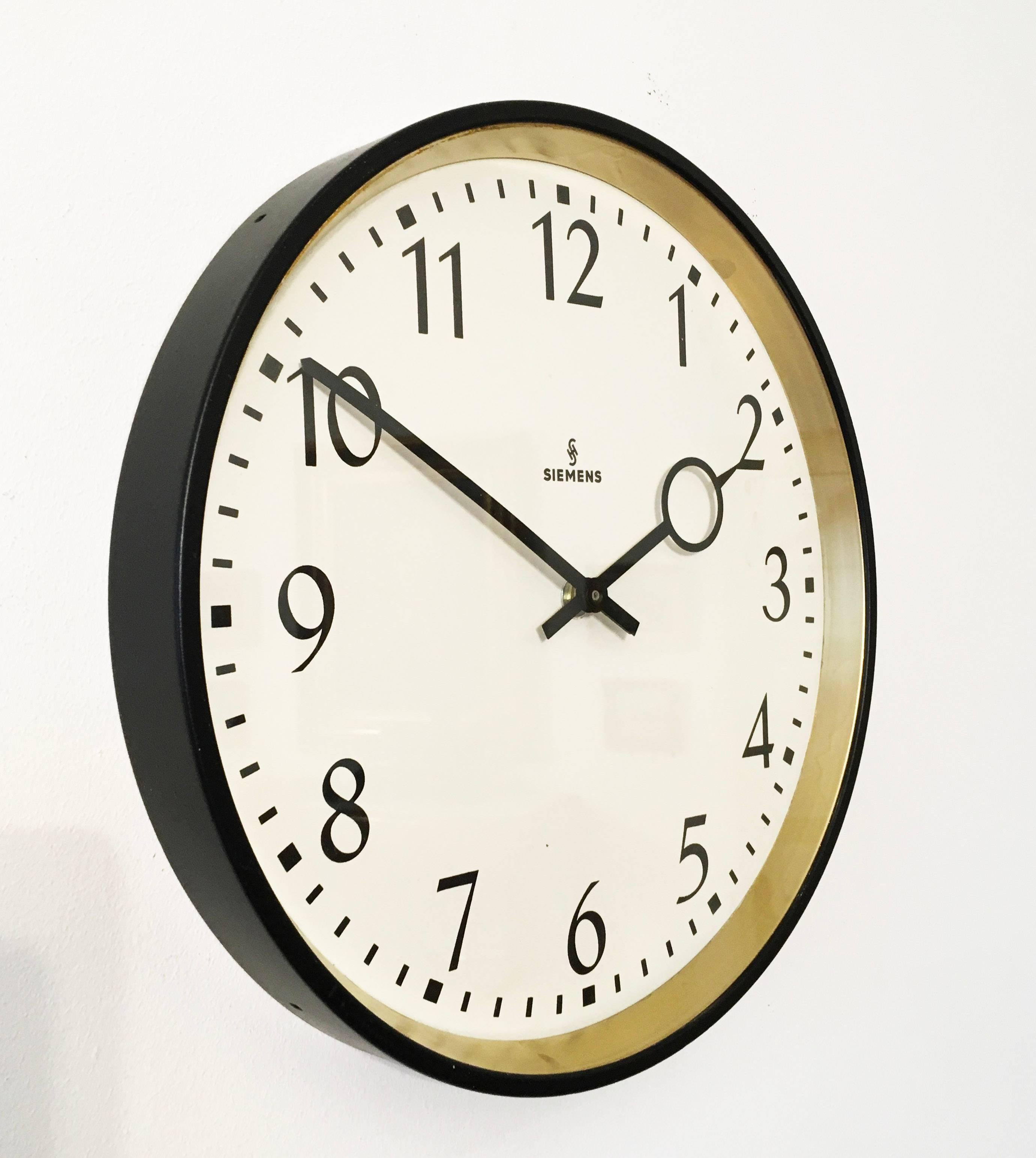 Steel painted with glass front made in Germany in the 1960s.
Formerly a slave clock, it is now fitted with a modern quartz movement with a AA battery.