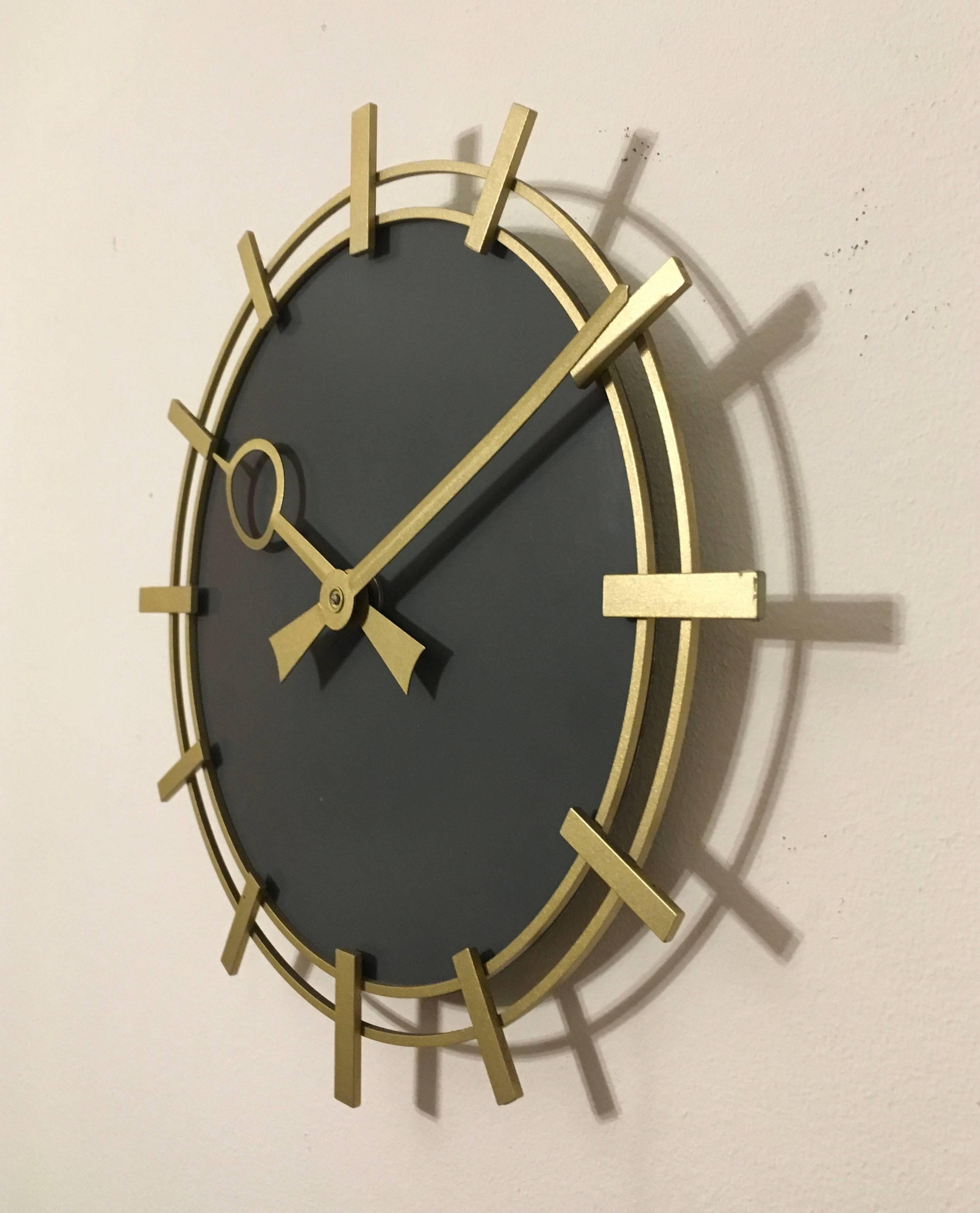 Brass frame with a painted clock face made in Germany in the 1970s.
Formerly a slave clock, it is now fitted with a modern quartz movement with a AA battery.