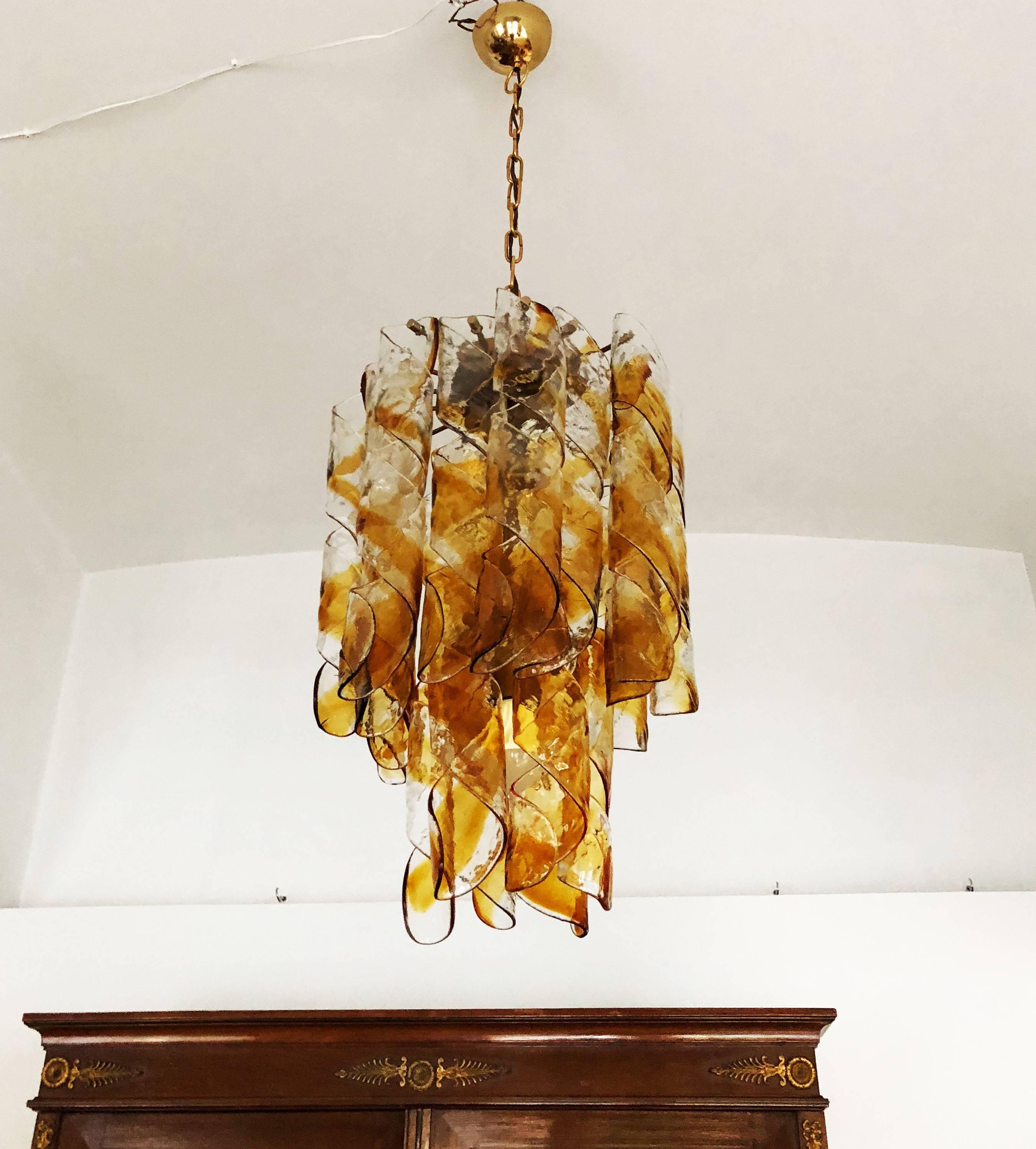 Italian Murano amber twisted glass ceiling light by Mazzega is from the 1960s, fitted with four E27 sockets.