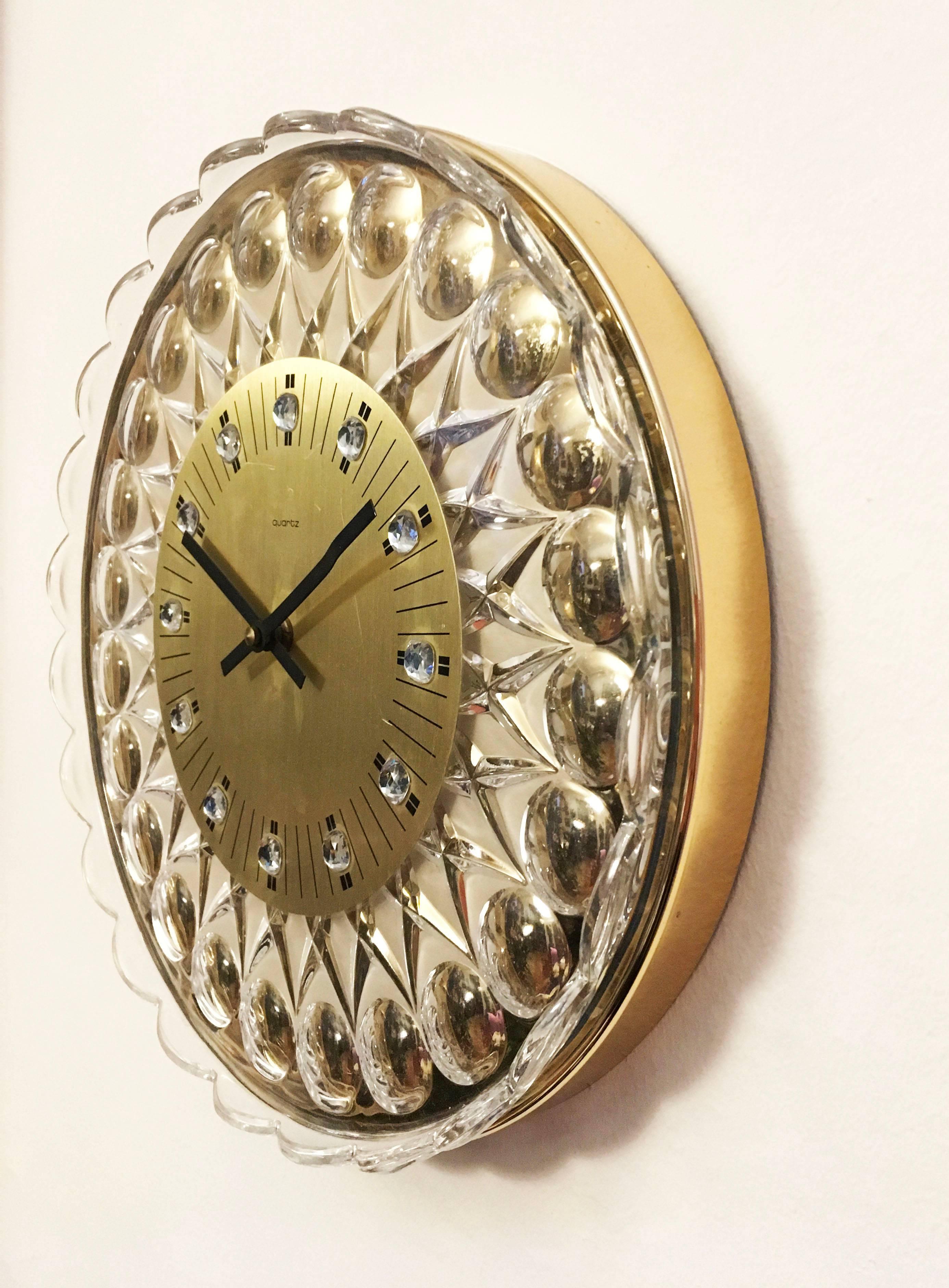 A wonderful, glamorous crystal wall clock attributed to Palwa which would lend a dash of elegance to any room. Fitted with a Junghans battery movement.