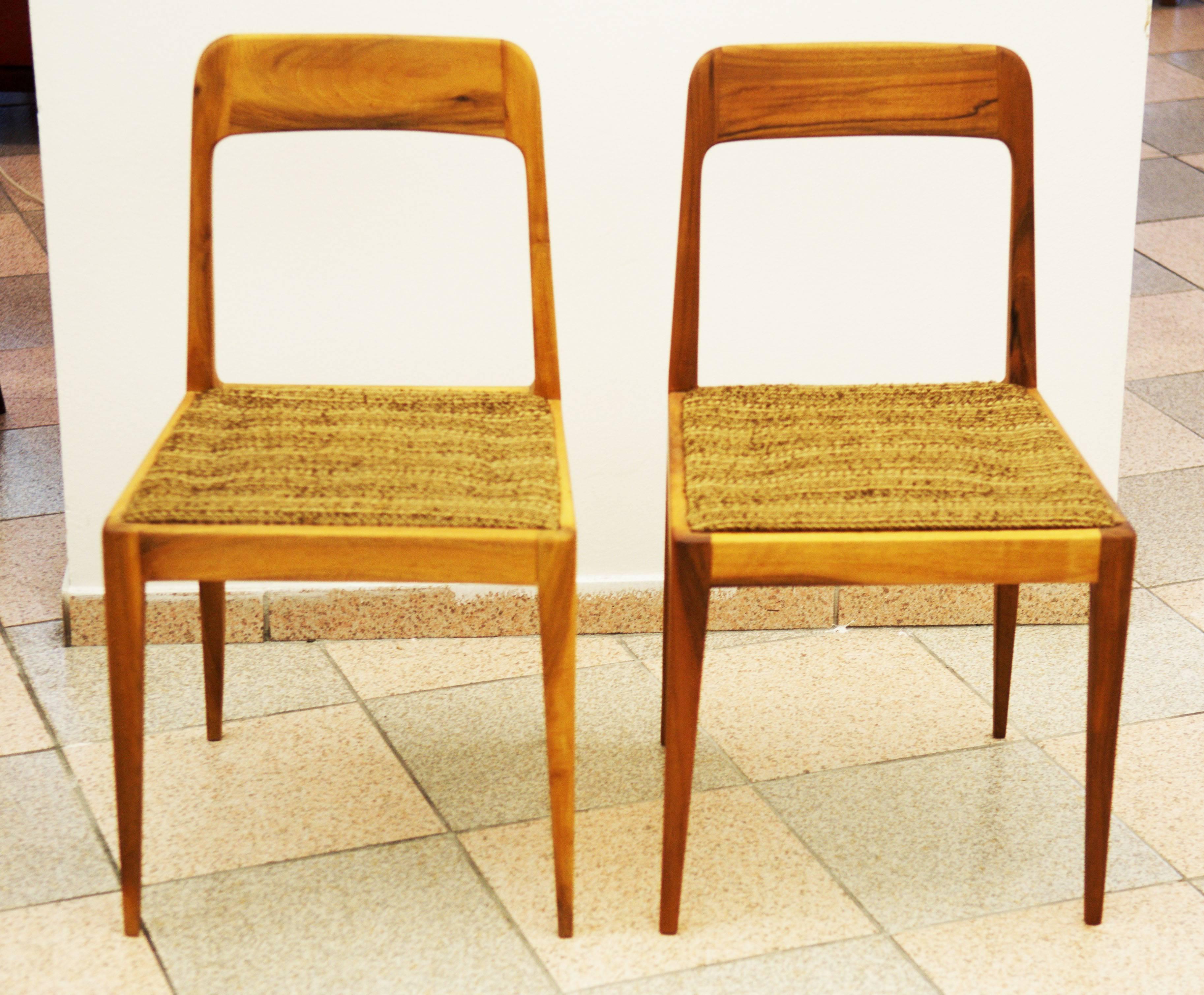 Set of two side chairs by Carl Auböck Junior form 1950s.
Designed as light weight chair in cherry wood with rounded, slightly tapered backrest.
The upholstery is still the original one.