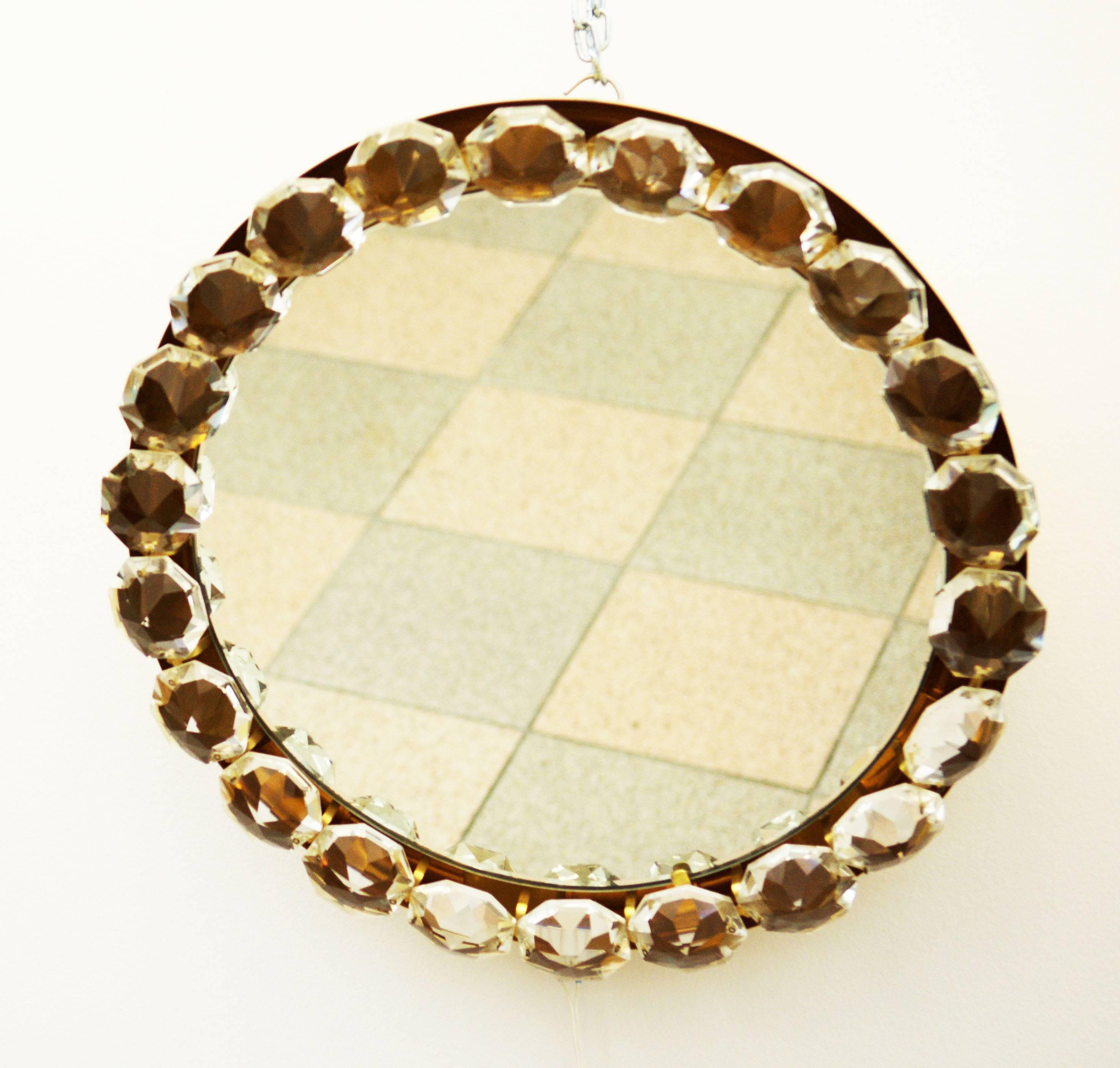 Gold-plated brass, hand-cut crystals, Vienna, Austria from 1960s.
Dimensions: 54x8 cm
The mirror is in good condition with slight races of use.