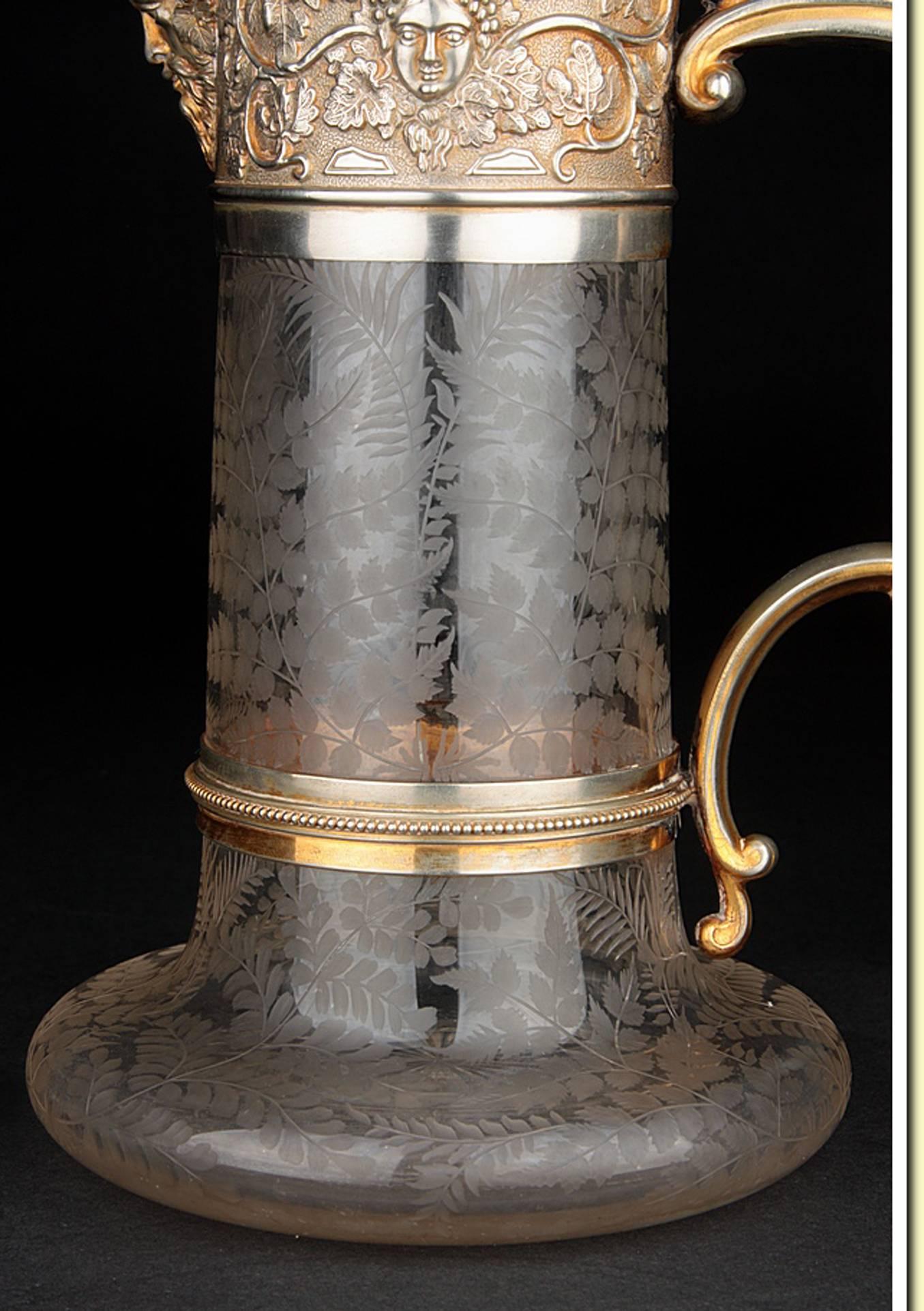 Beautiful brass and silver-plated pitcher from the mid-nineteenth century. With label
Elkington, Mason & Co.
Intricately engraved glass.