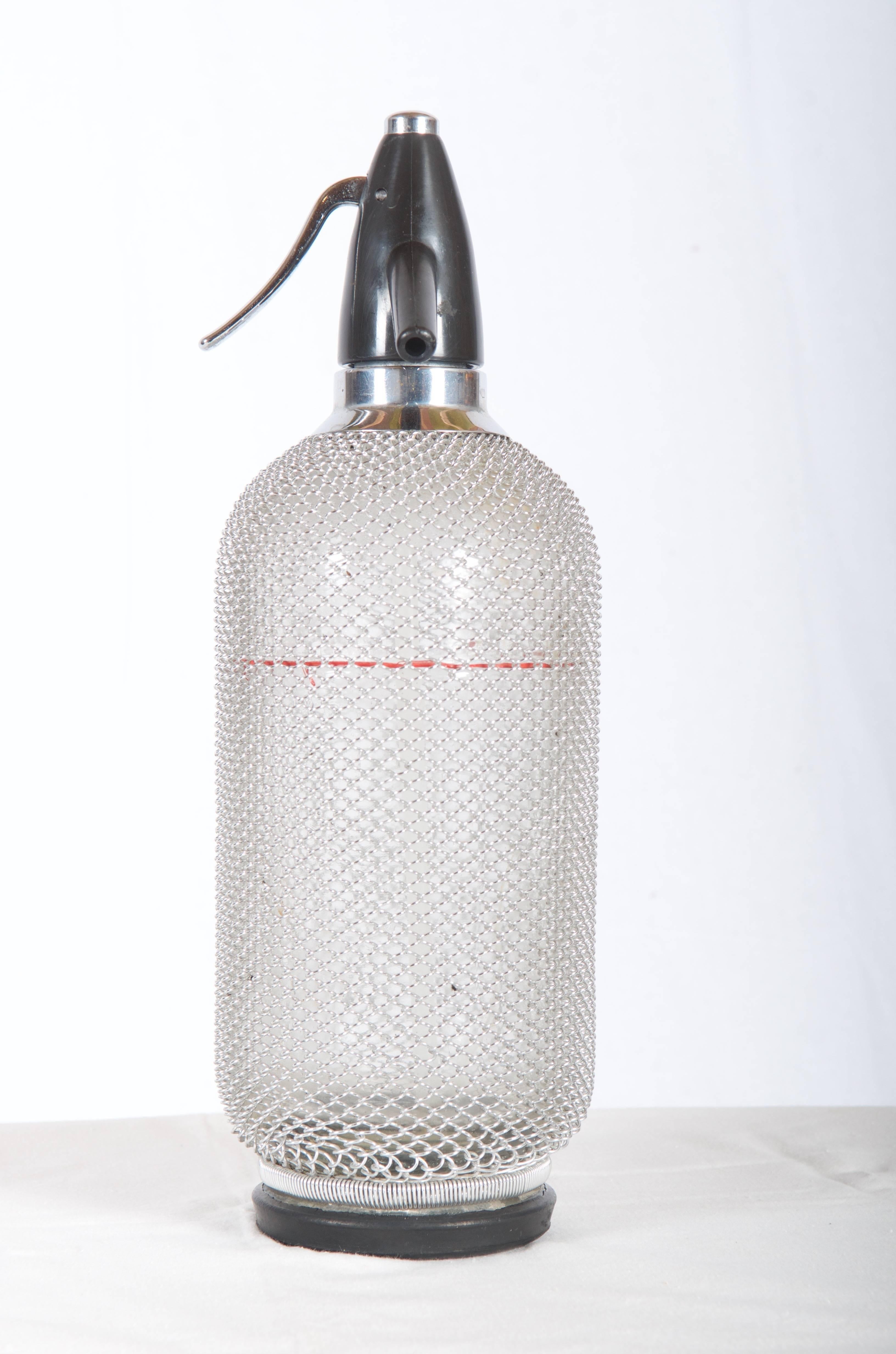 Mid-Century Modern Soda Siphon Seltzer Bottle with Wire Mesh Metal Around Glass For Sale
