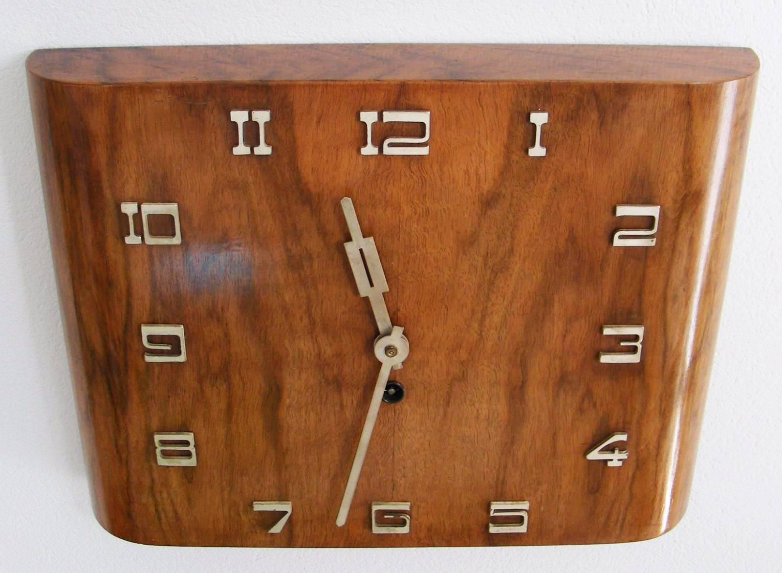 Art Deco Kienzle wall clock from about 1930's
walnut veneer and chrome letters
Signed on the back side 