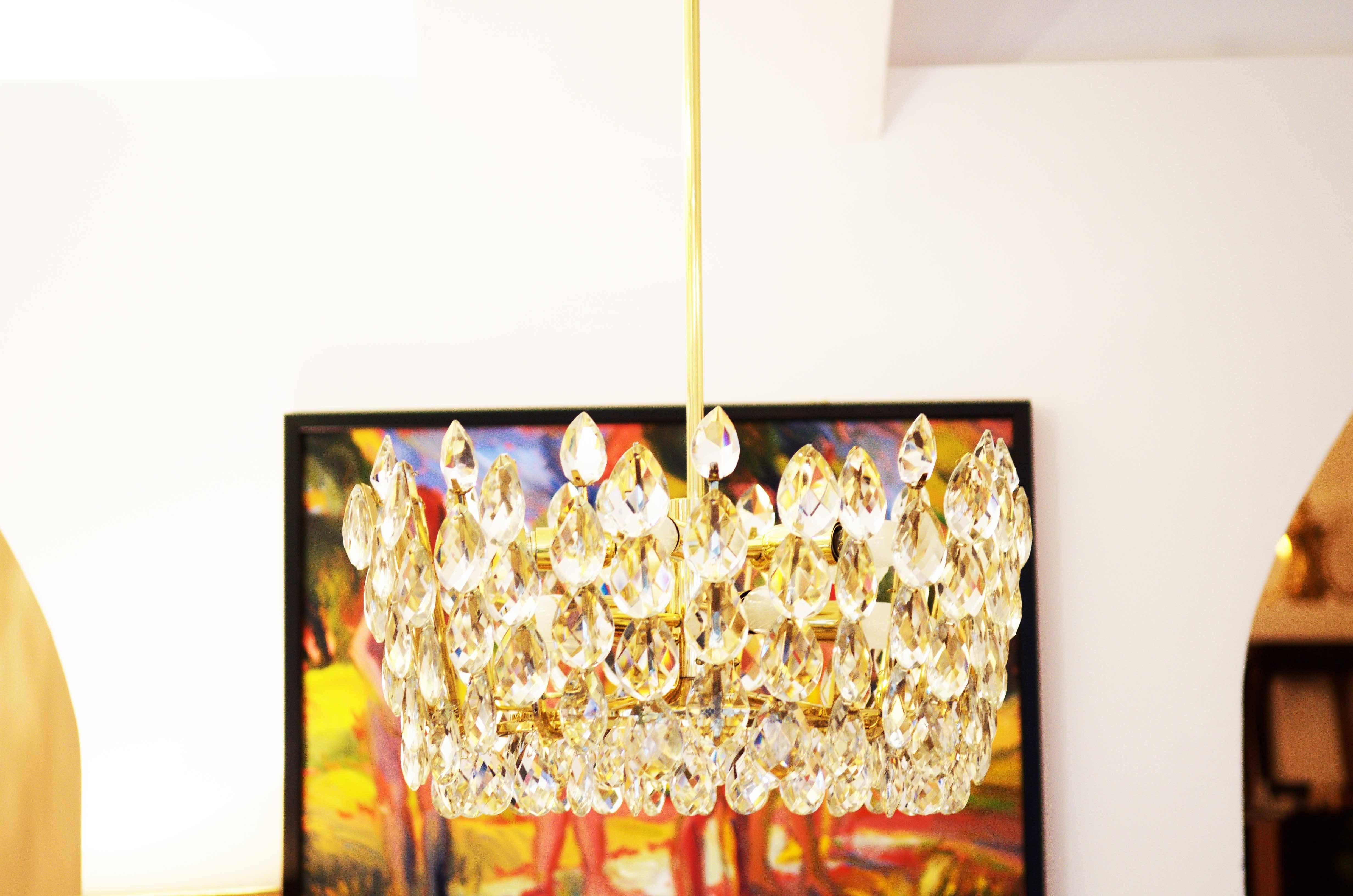 Brass frame with ten E14 bulbs and hand cut crystals by Bakalowits and So¨hne from the 1960s.
fully restored and rewired.
Dimention the lamp only: 52x27cm (20.47x10.62in).
 
