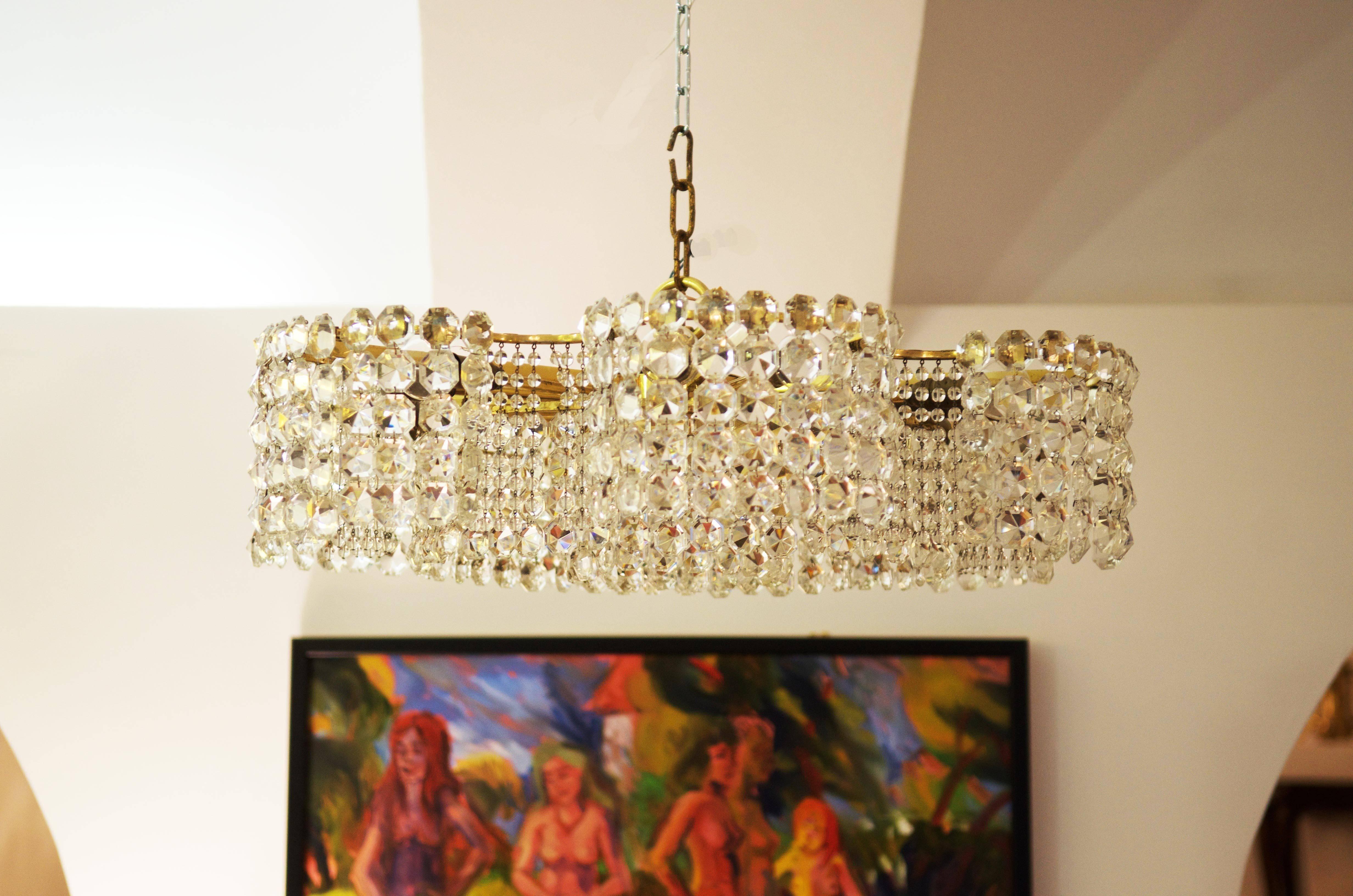Brass frame gold-plated with twelve E14 sockets.
Signet on the frame from the 1950s.
Perfect original condition, two pieces available
Dimension of the chandelier only without the chain 70 x 20cm.