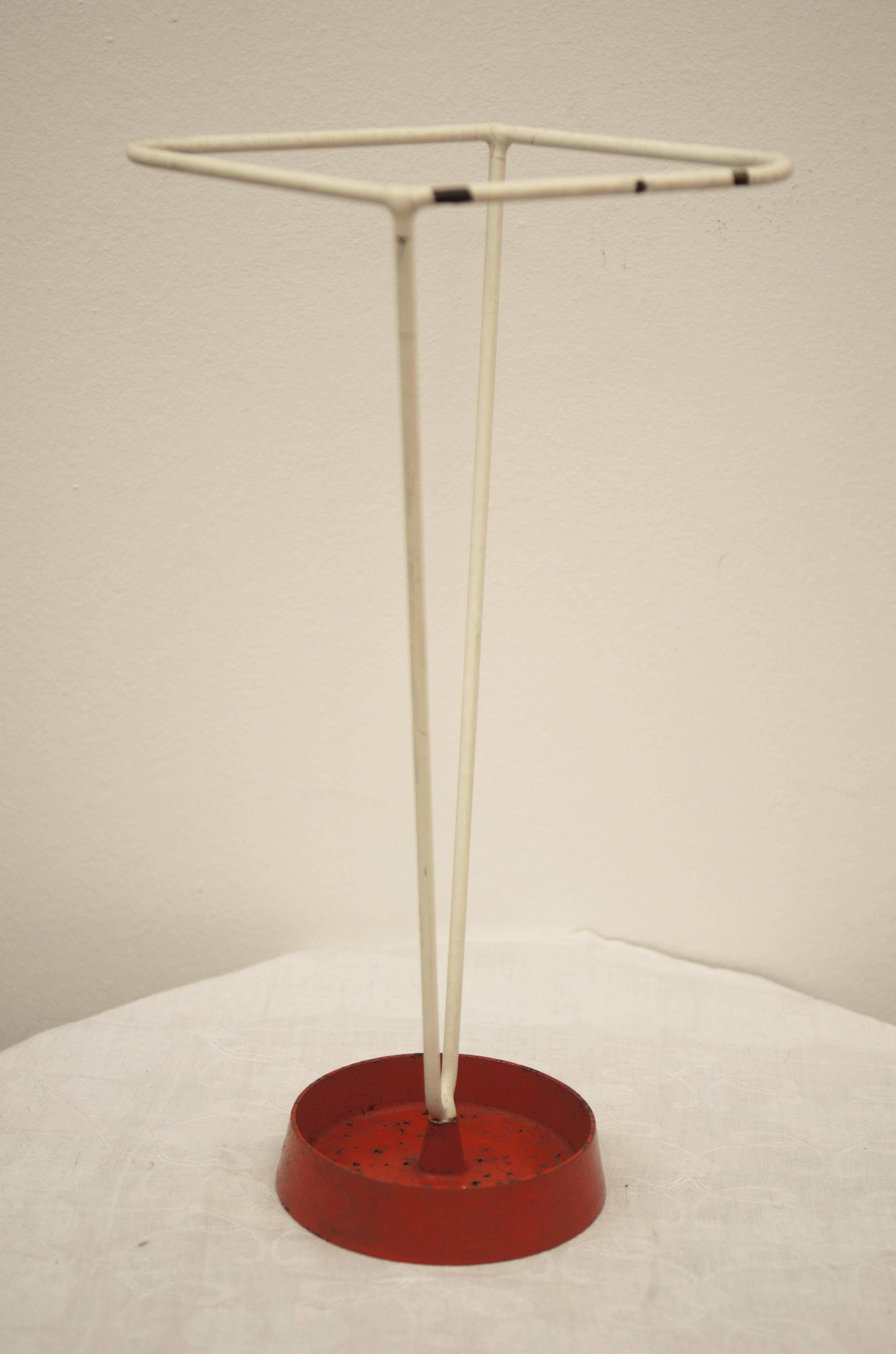 Stand foot made of cast iron with steel umbrella holders covered with plastic from the 1950s.