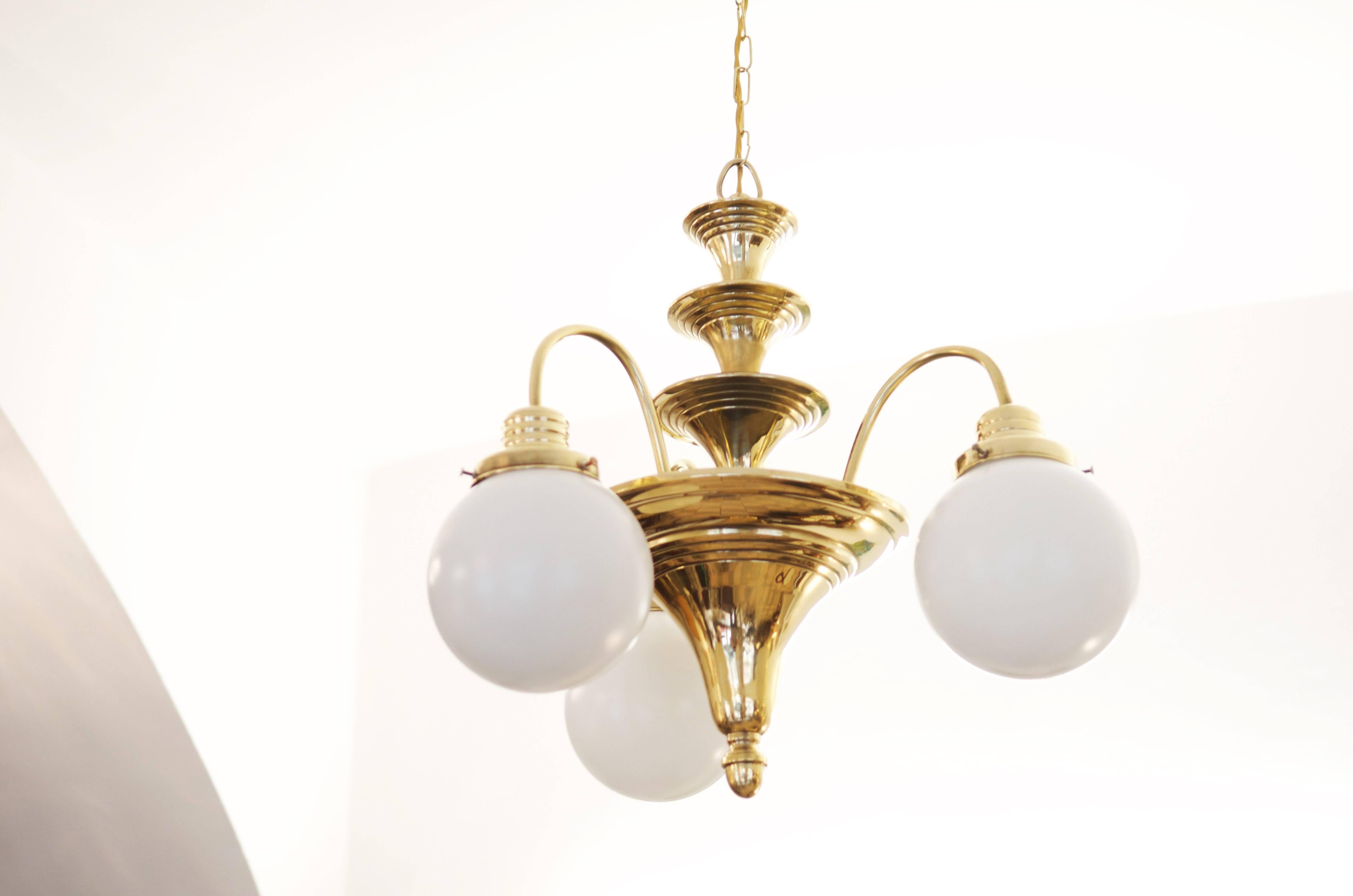 Brass construction with three opal glass ball shades.
Fully restored with E27 sockets.