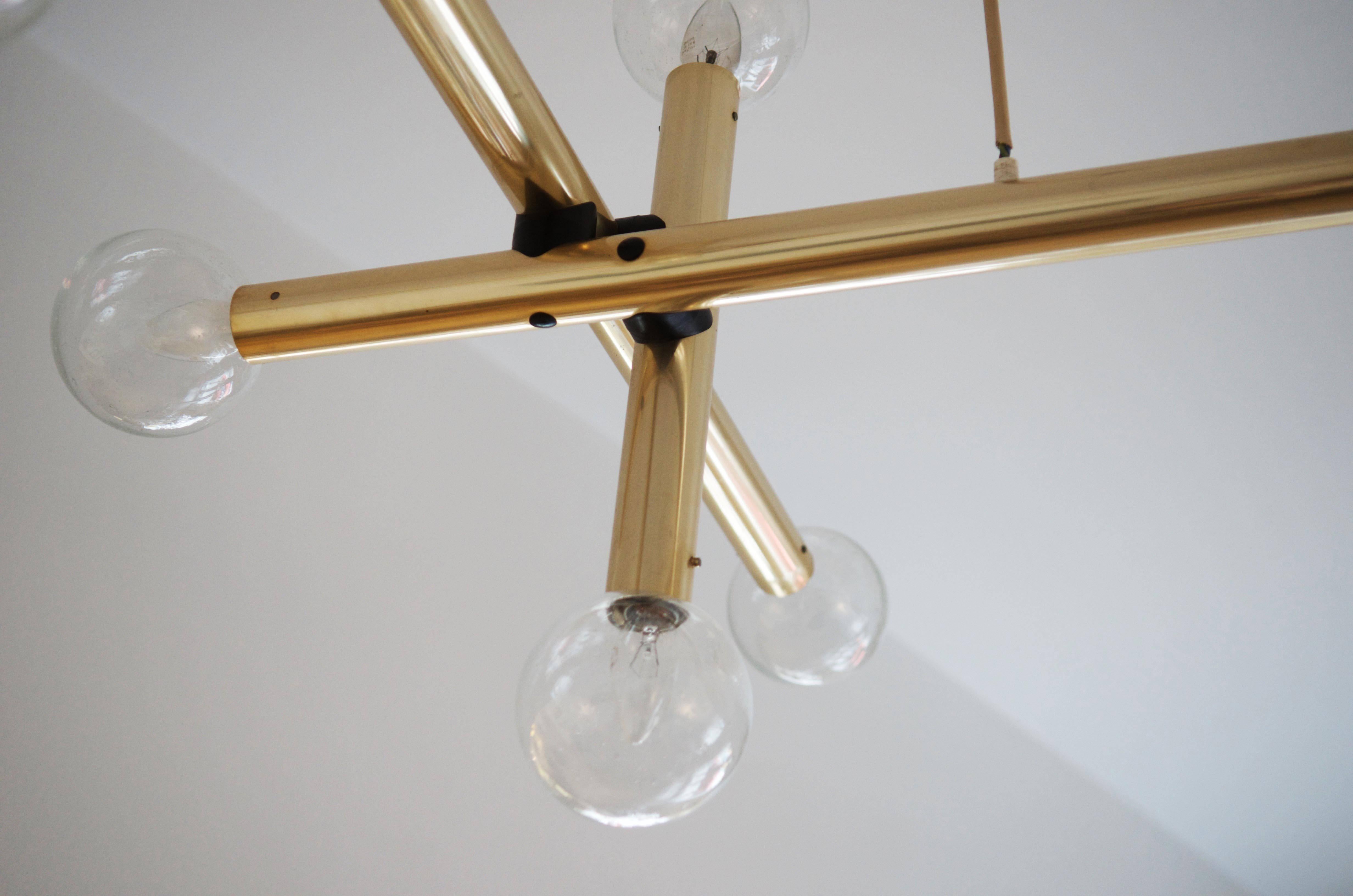 Rare RS 16 HL System by J.T. Kalmar from the 1970s. The construction is made of four long and four short tubes and 16 hand blow glass shades (each 12cm or 4,72inch diameter), powered with 16 E14 bulbs.
Dimensions see the last picture.
Up to five