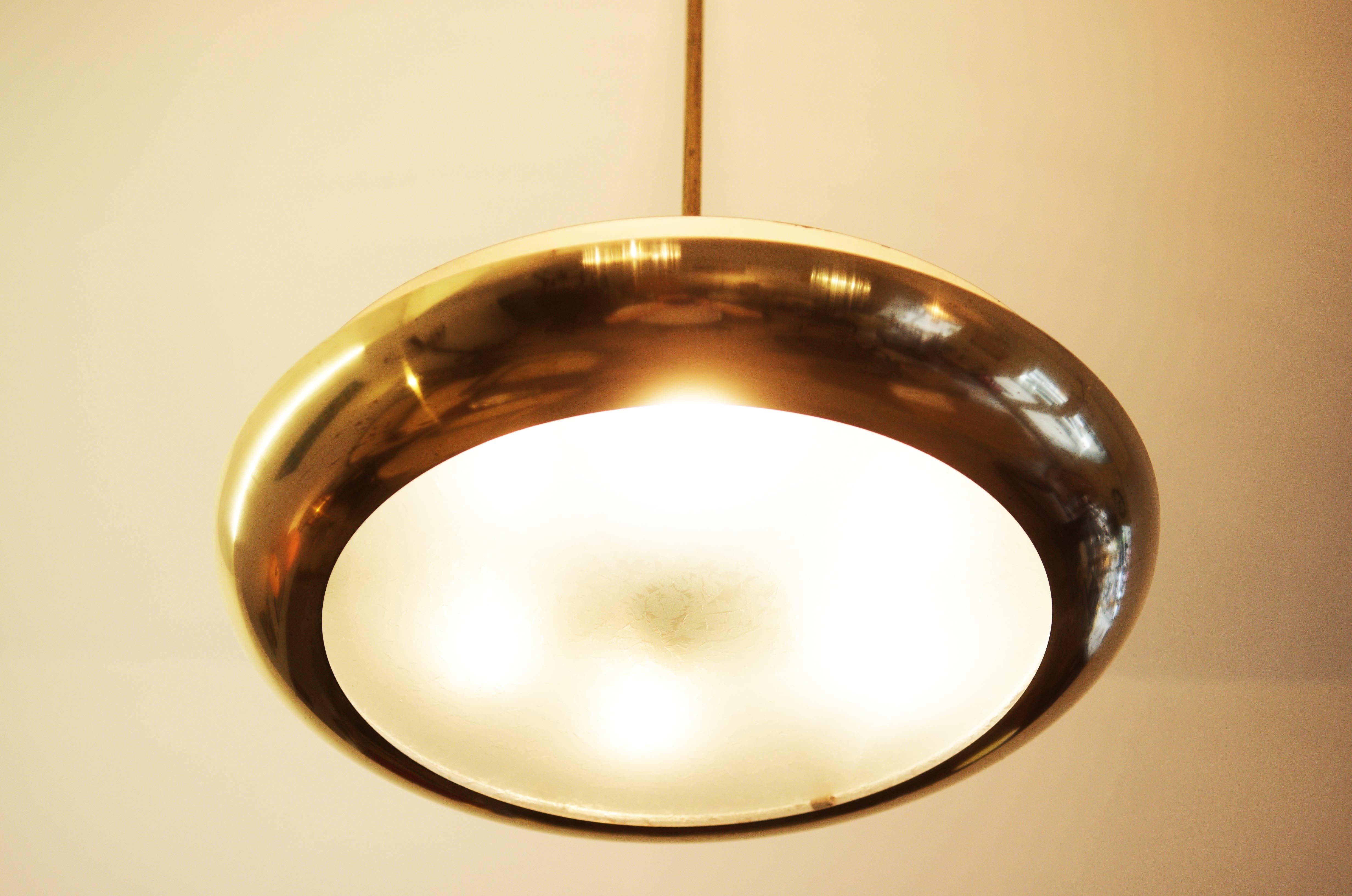 Bauhaus pendant from about 1930s by Josef Hurka for Napako.
Brass construction, the lamp holds six bakelite E27 sockets,
restored, new electric.
Dimention: Diameneter: 52cm (20.57in).
The total length is now about 75cm (29.52in) can also provide
