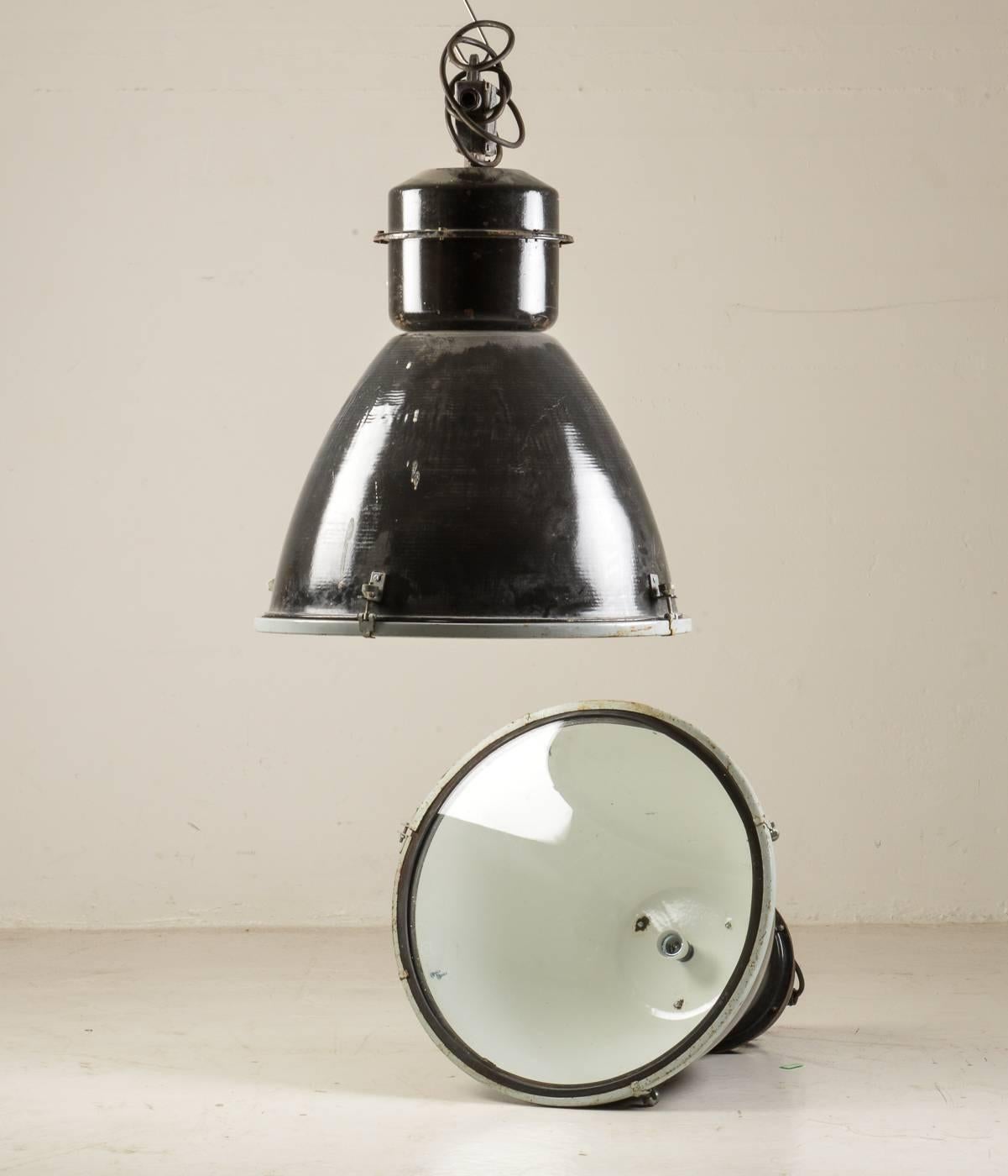 Czech industrial pendants with black enamelled steel screen from the 1960s.
Dimensions: 
Height approximately 72cm, Ø 53 cm. 
Up to 100 pieces available.