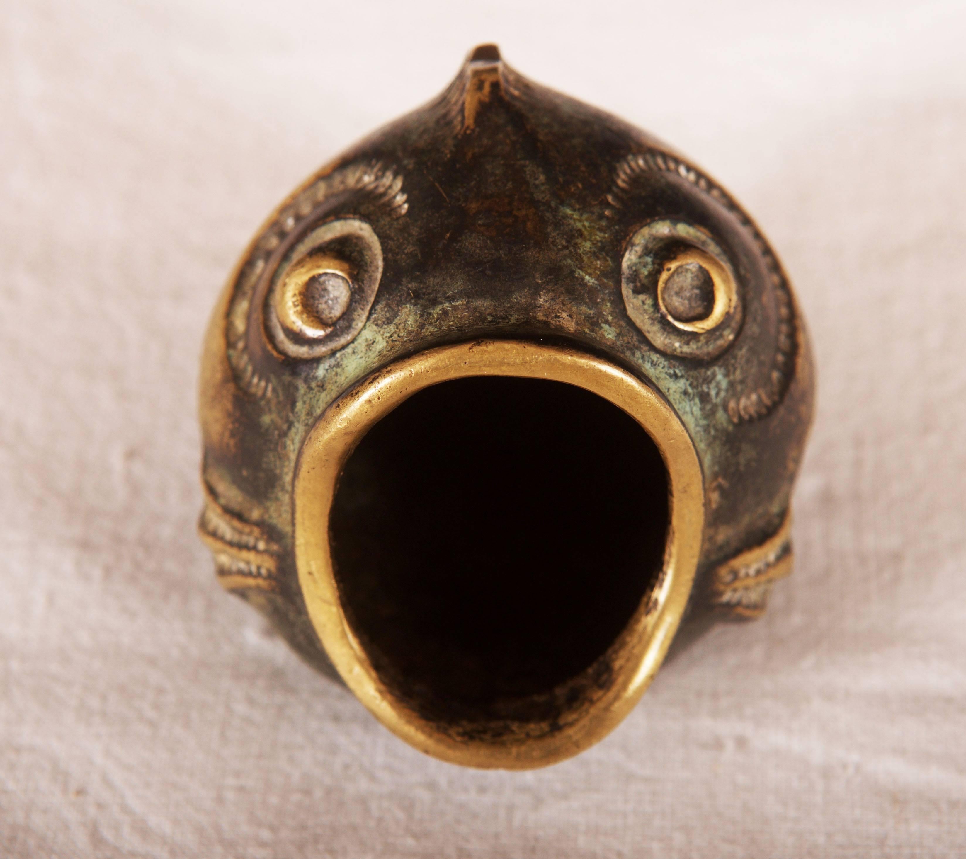 By Walter Bosse designed for Hagenauer in the 1950s.
It has a form of a fish and was made of blackened brass.
 