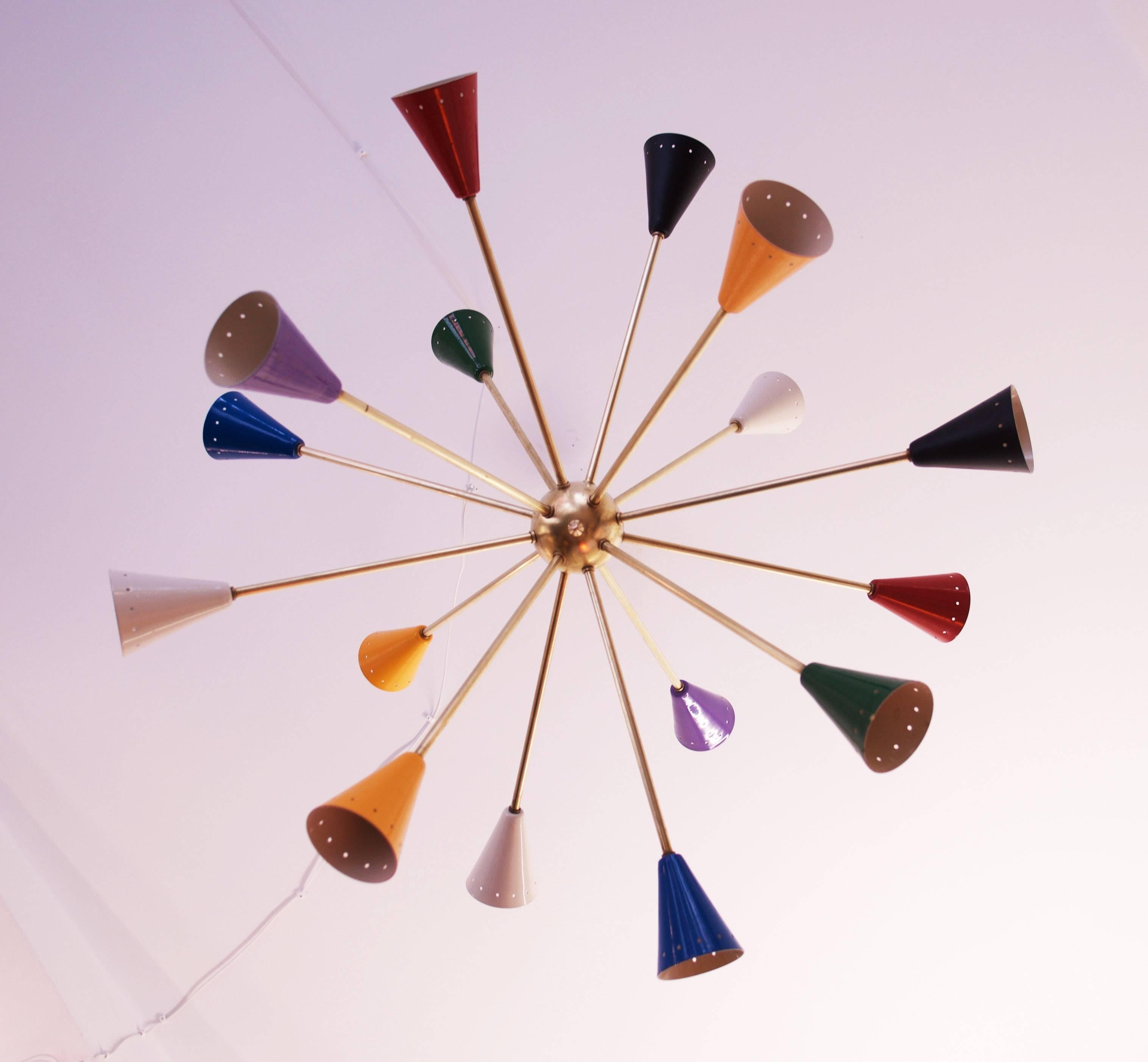 Large and colorful Sputnik chandelier in the style of Stilnovo, Arredoluce from the 1950s.
Brass construction with sixteen arms and E14 porcelain sockets inside the colored cone.