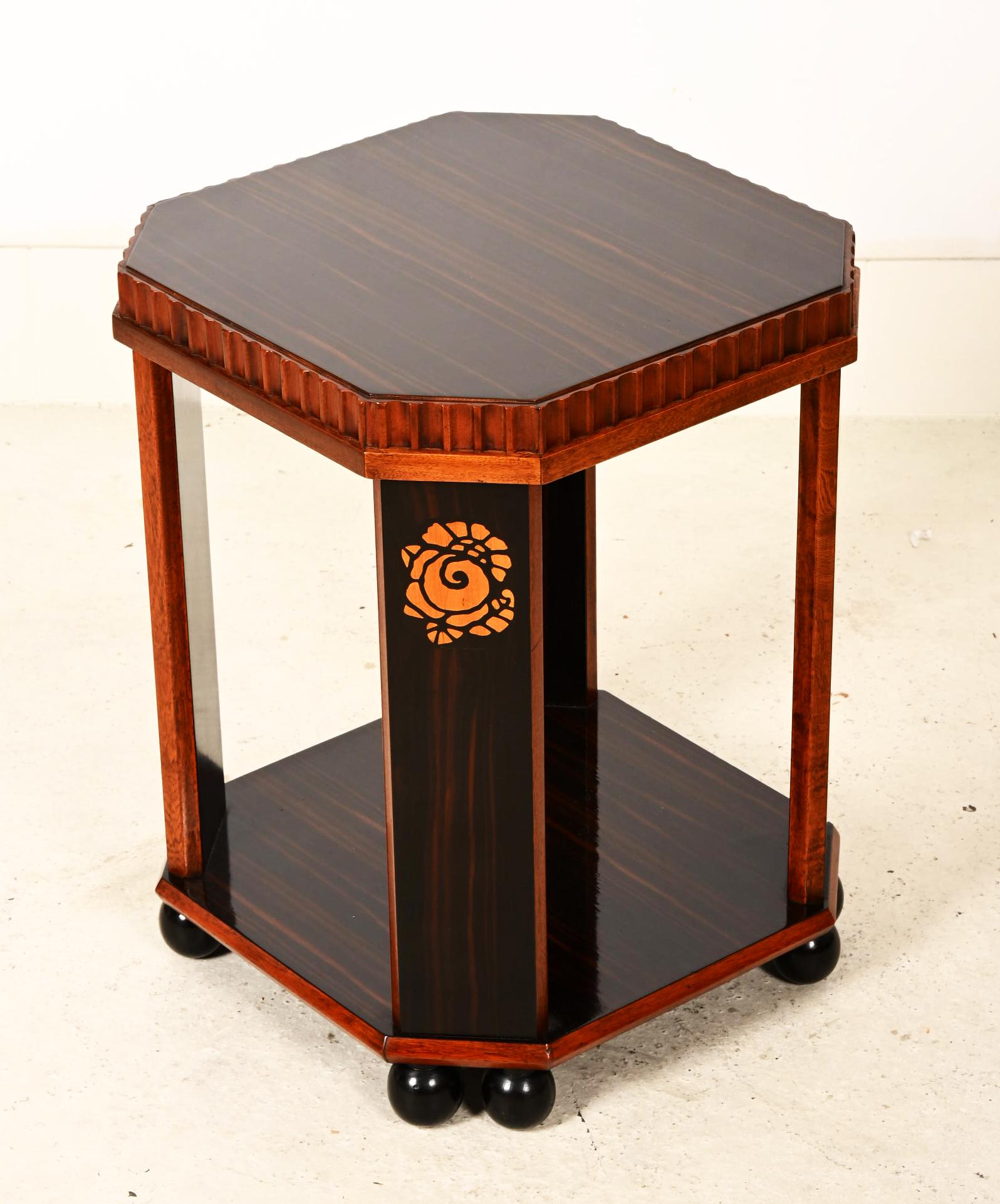 Rare and beautiful side table, inlaid decoration, ball feet, partially veneered with Macassar. Made in France in the 1920s. Excellent restored with shellack finish. 