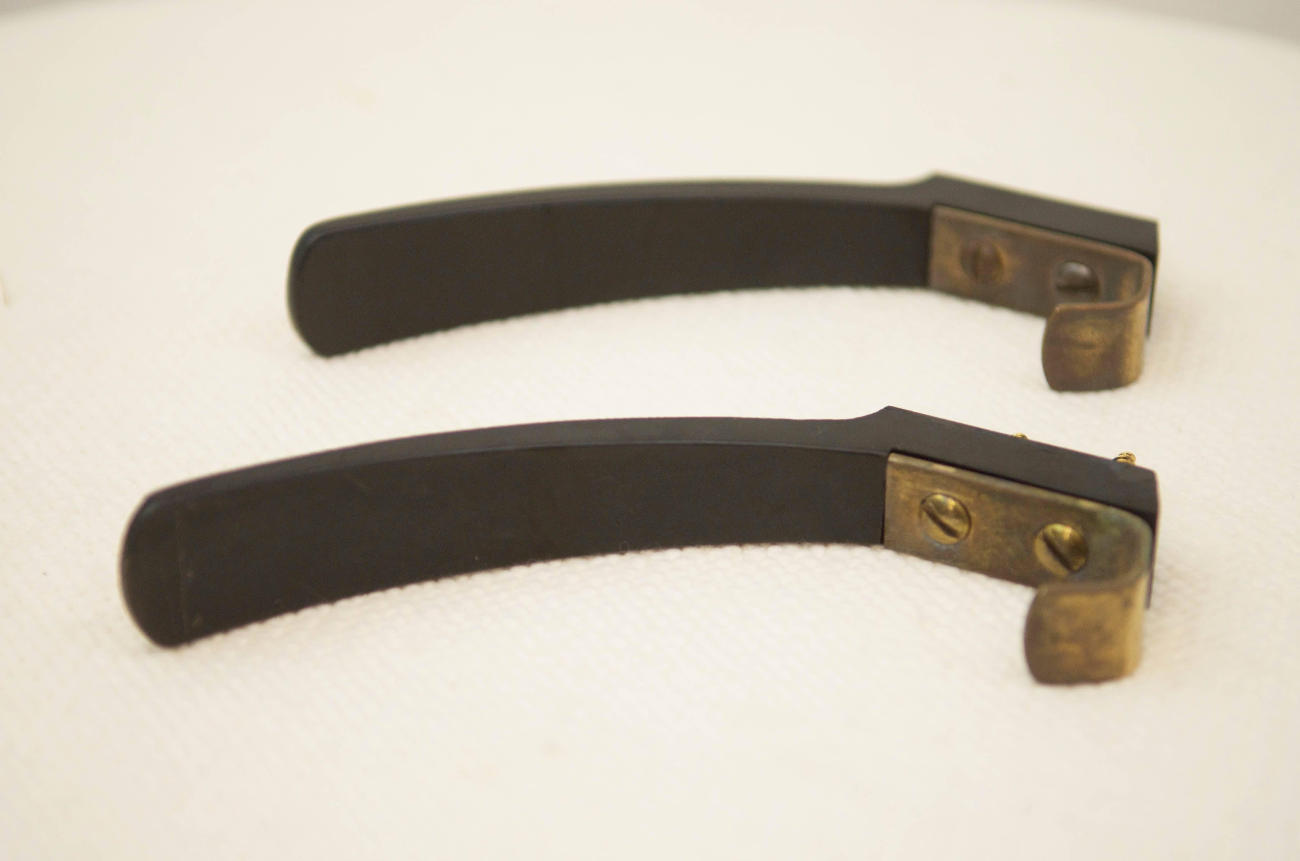 Bakelite and brass construction with two screws made in Austria in the 1960s.