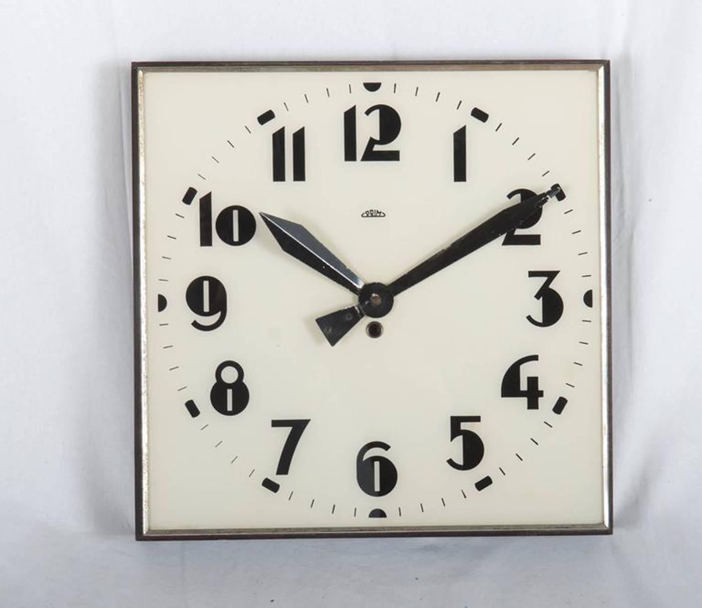 Wooden frame with white glass and black digits cought in steel, made by Prim in the 1930s. The original movement will be changes to an electric one powered with a small battery. Delivery time 2-3 weeks.