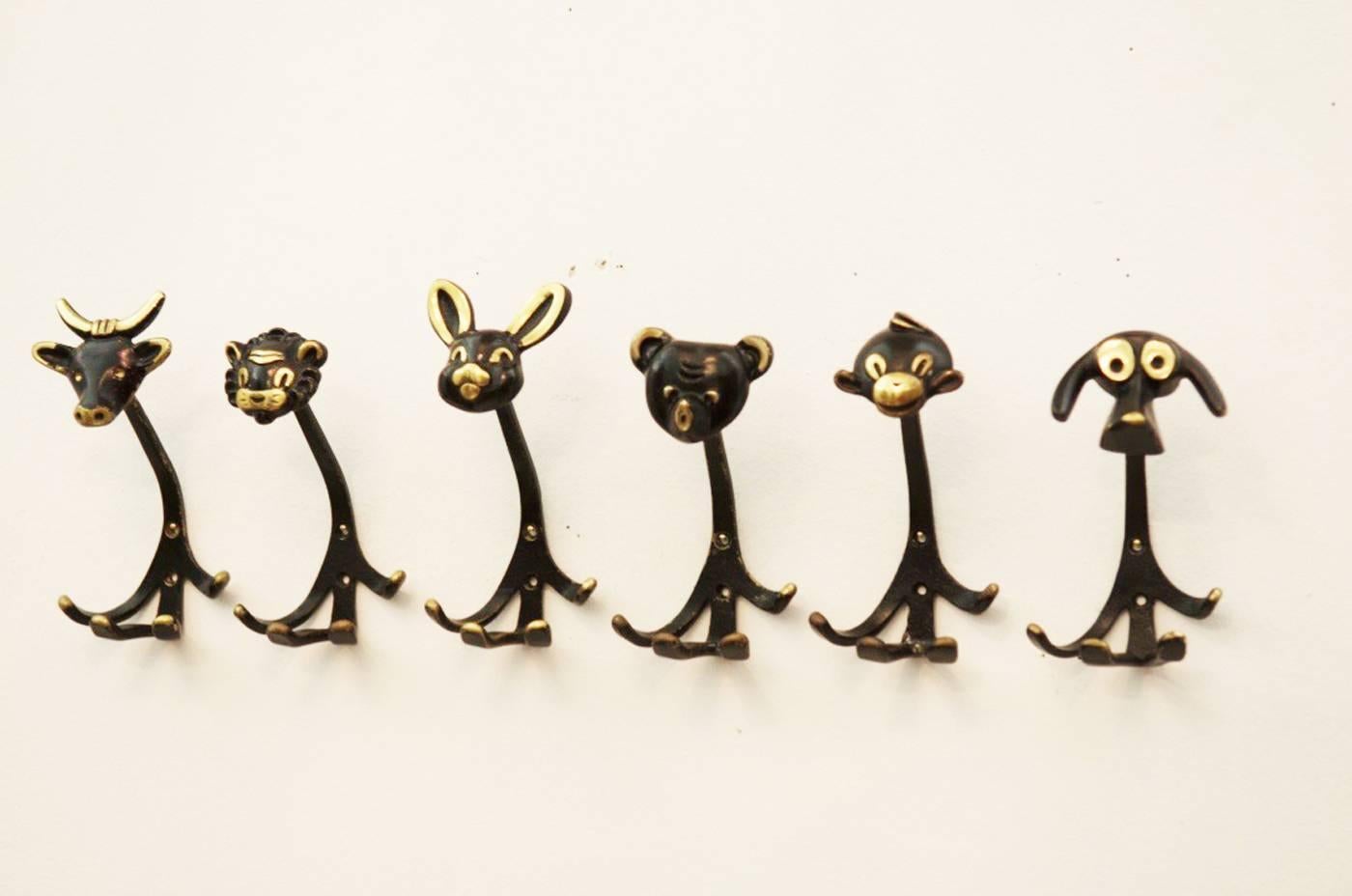 Brass Set of Four Wall Hooks by Walter Bosse