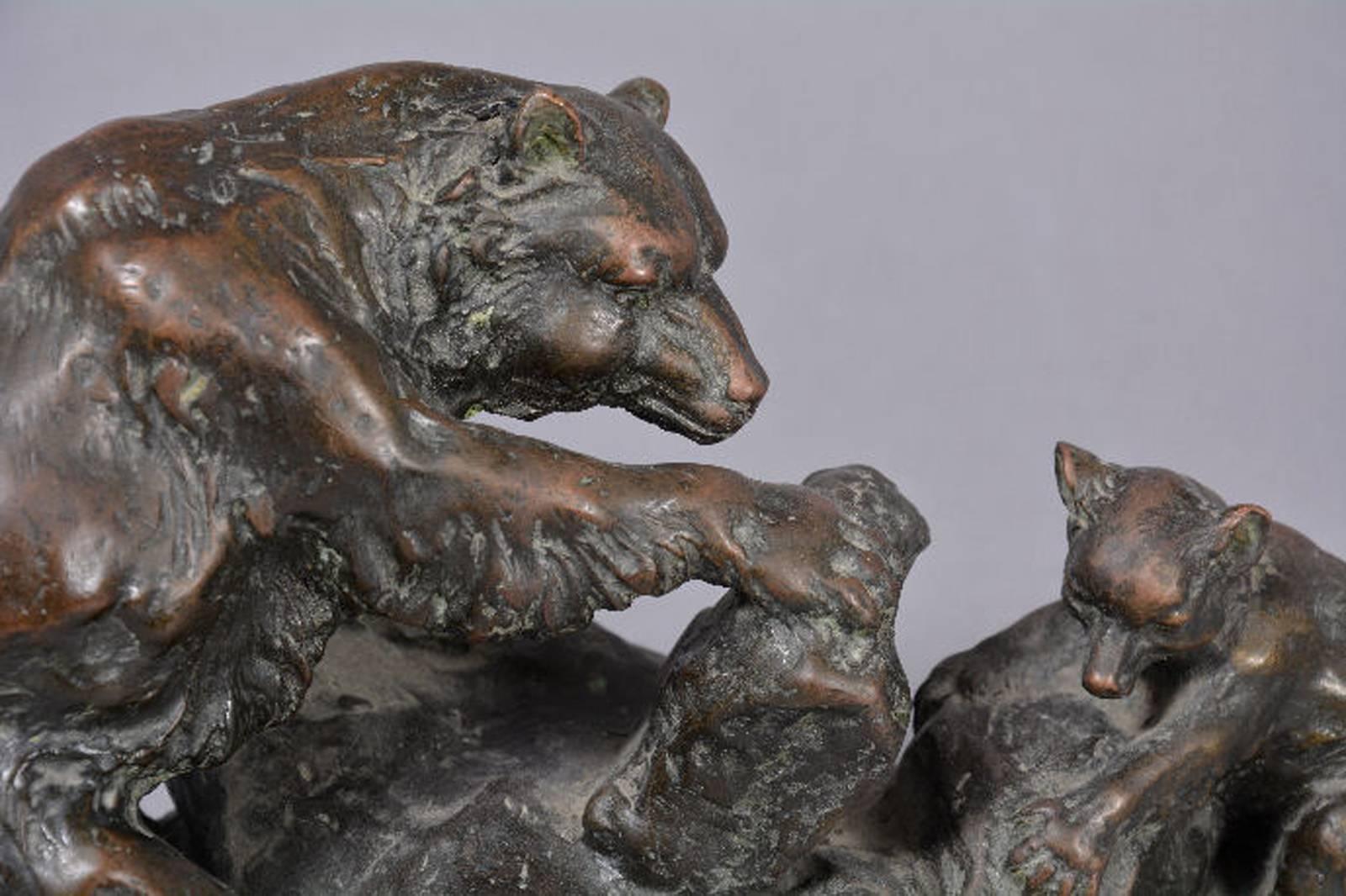 Bronze sculpture in the form of black bear figurine group with the parents and youngsters looking for food. By Charles M. Russell (1864-1926). 
Marble base.