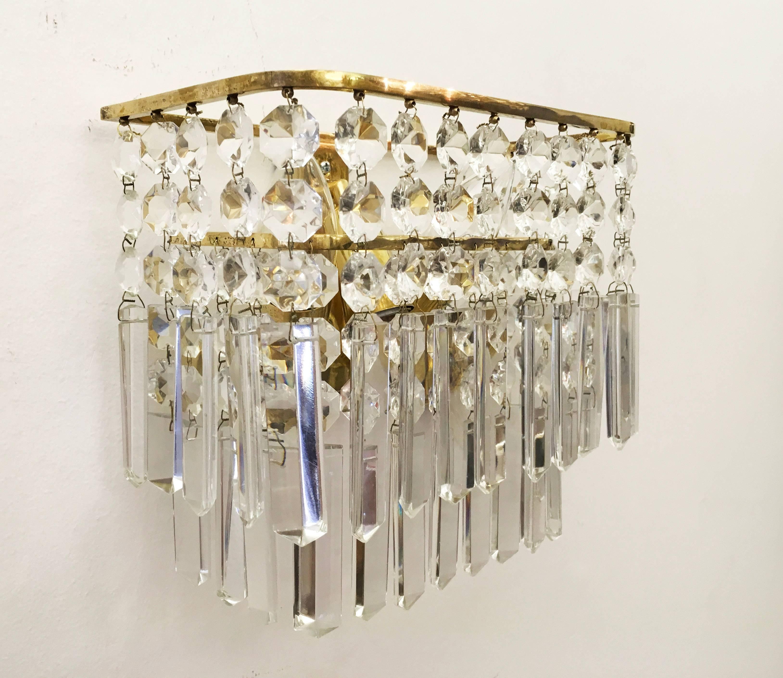 Brass construction fitted with three E14 sockets and cut crystal elements (octagons and spears). Made By Bakalowits & Sohne in Vienna in the 1960s.
Two pieces available and also a suitable chandelier.