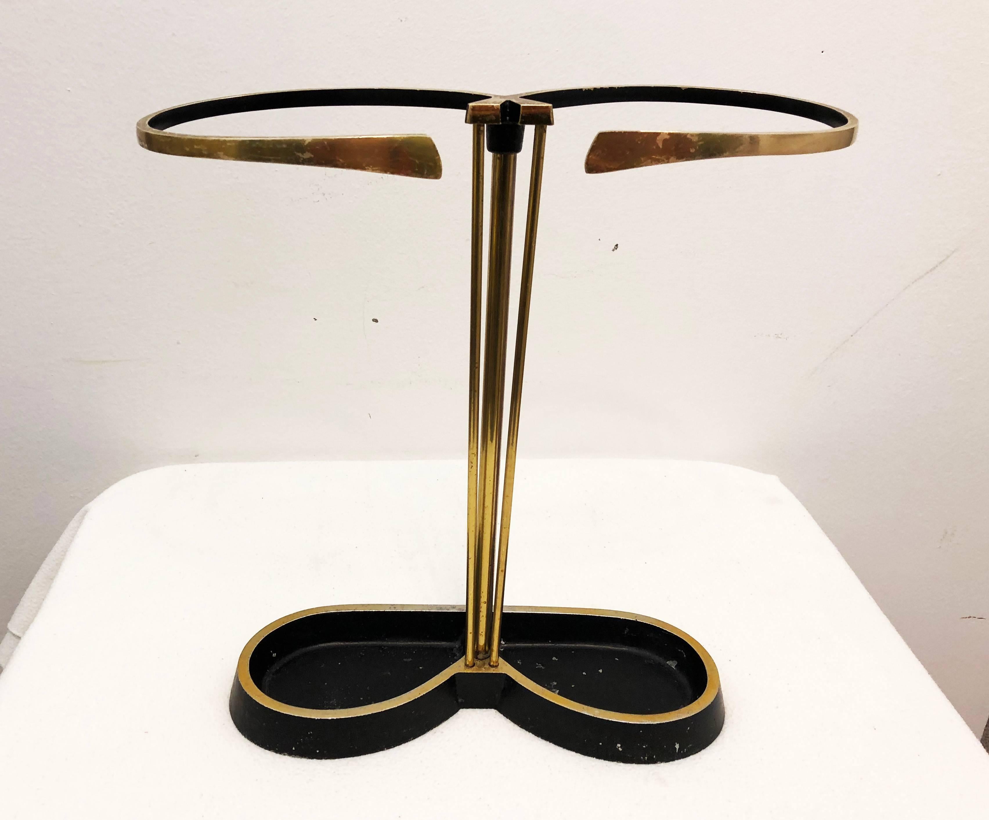 Mid-Century brass/aluminum partially black painted umbrella stand from the 1950s.