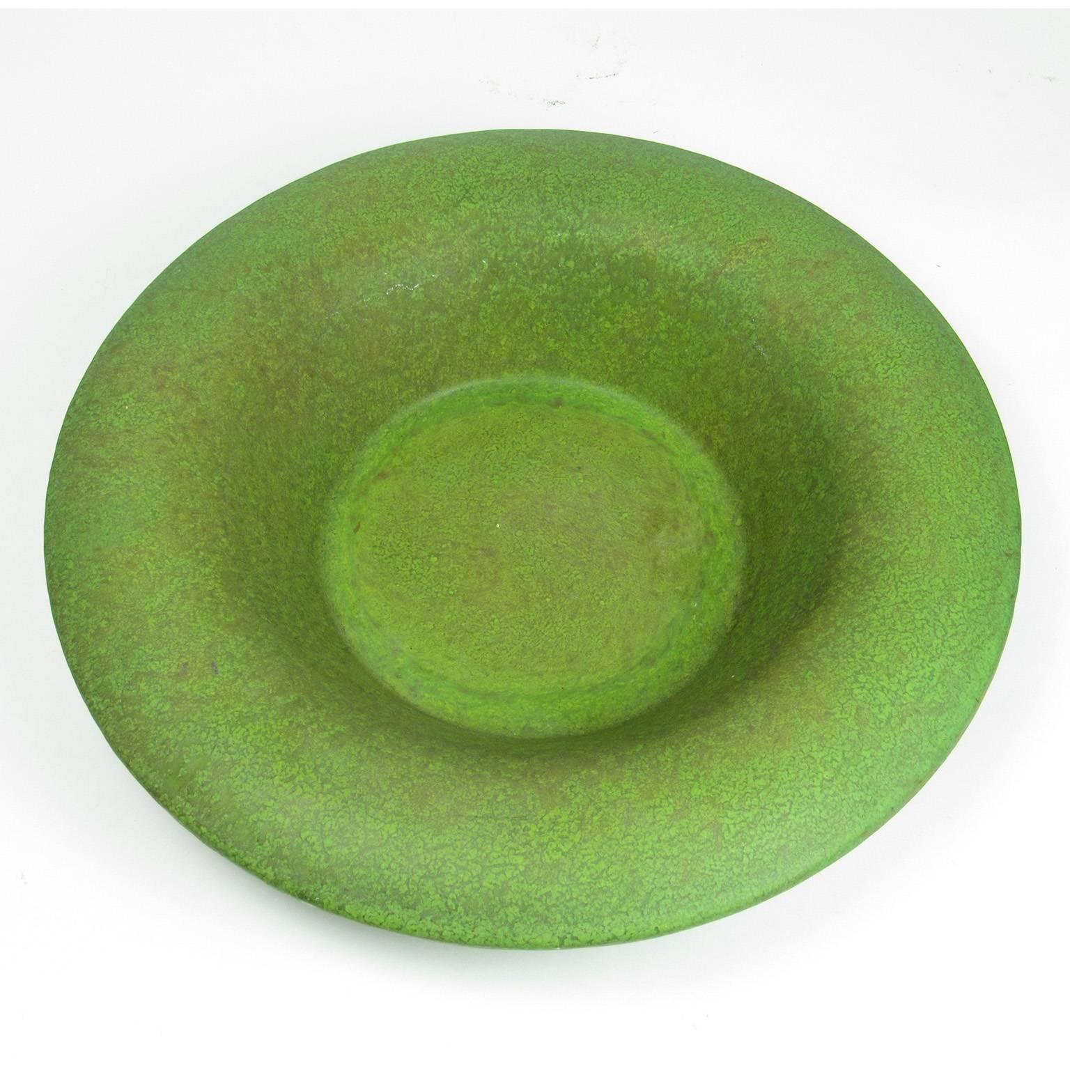 Unique Arts & Crafts period Mottled Matte green glazed ceramic shallow bowl with wide rim. Glaze appears similar to the cucumber matte green glazes of Hampshire Pottery (1883-1917) and Grueby Pottery. Unmarked. Diameter: 12 inches, height: 2 3/4
