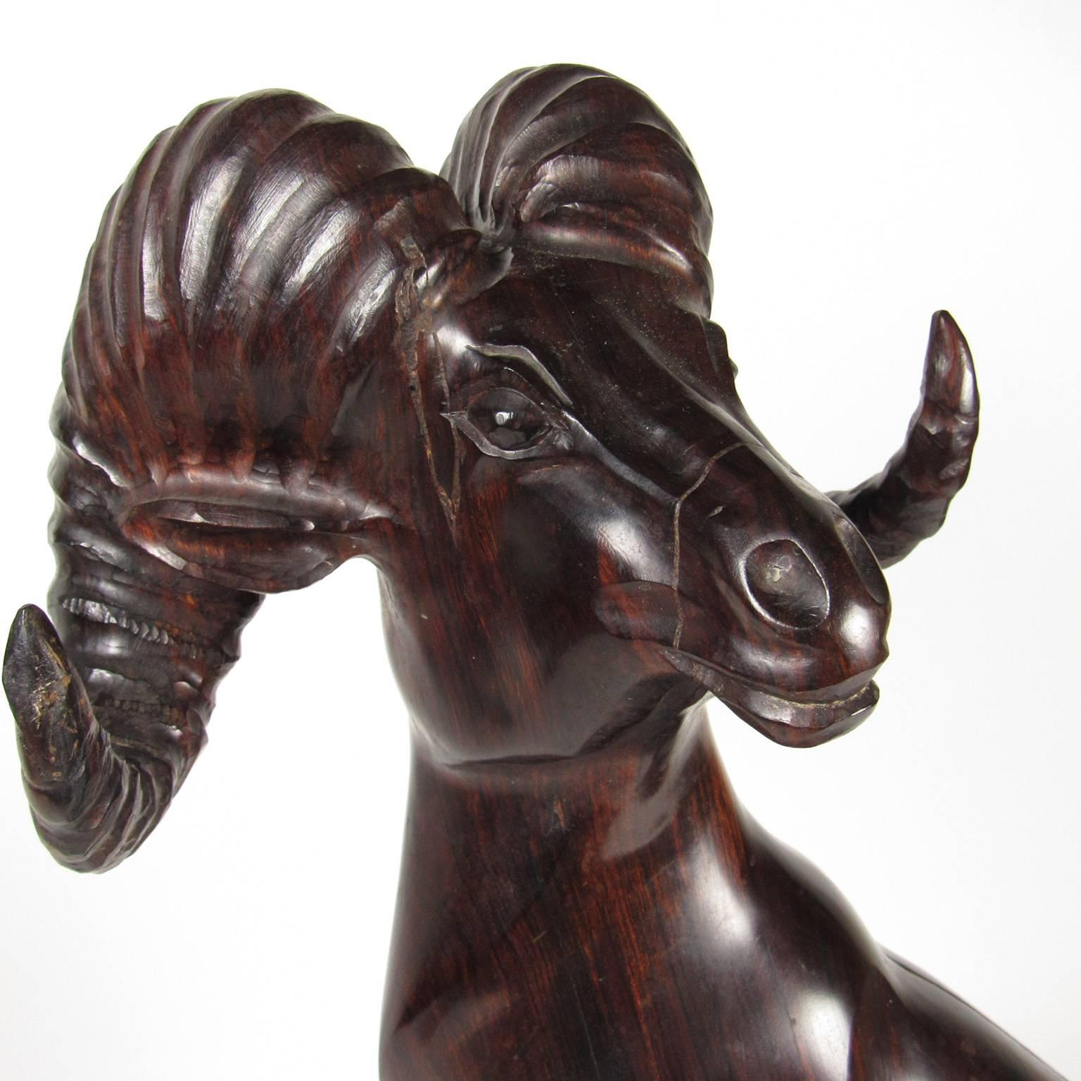 American School 20th century Folk Art carved wood figure of a ram, signed and dated D. Ayala '92 on base, possible attribution to Donna Ayala, a contemporary Texan sculptor who specialized in wildlife. Measure: Height 25 inches.