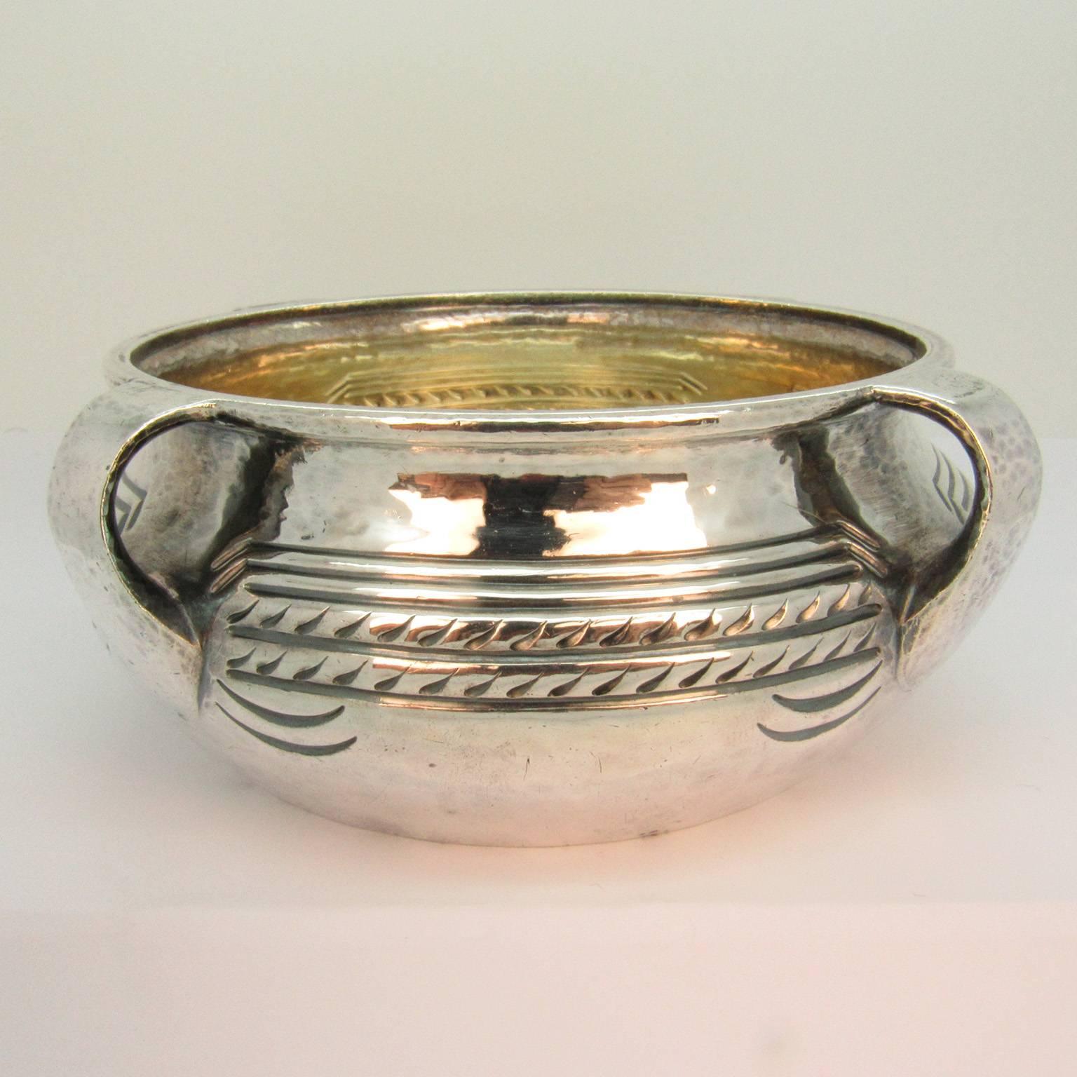 Frank Walter Lawrence (American, 1864-1929) Arts and Crafts period four handled hand-hammered sterling silver bowl with gold wash interior. Marked 