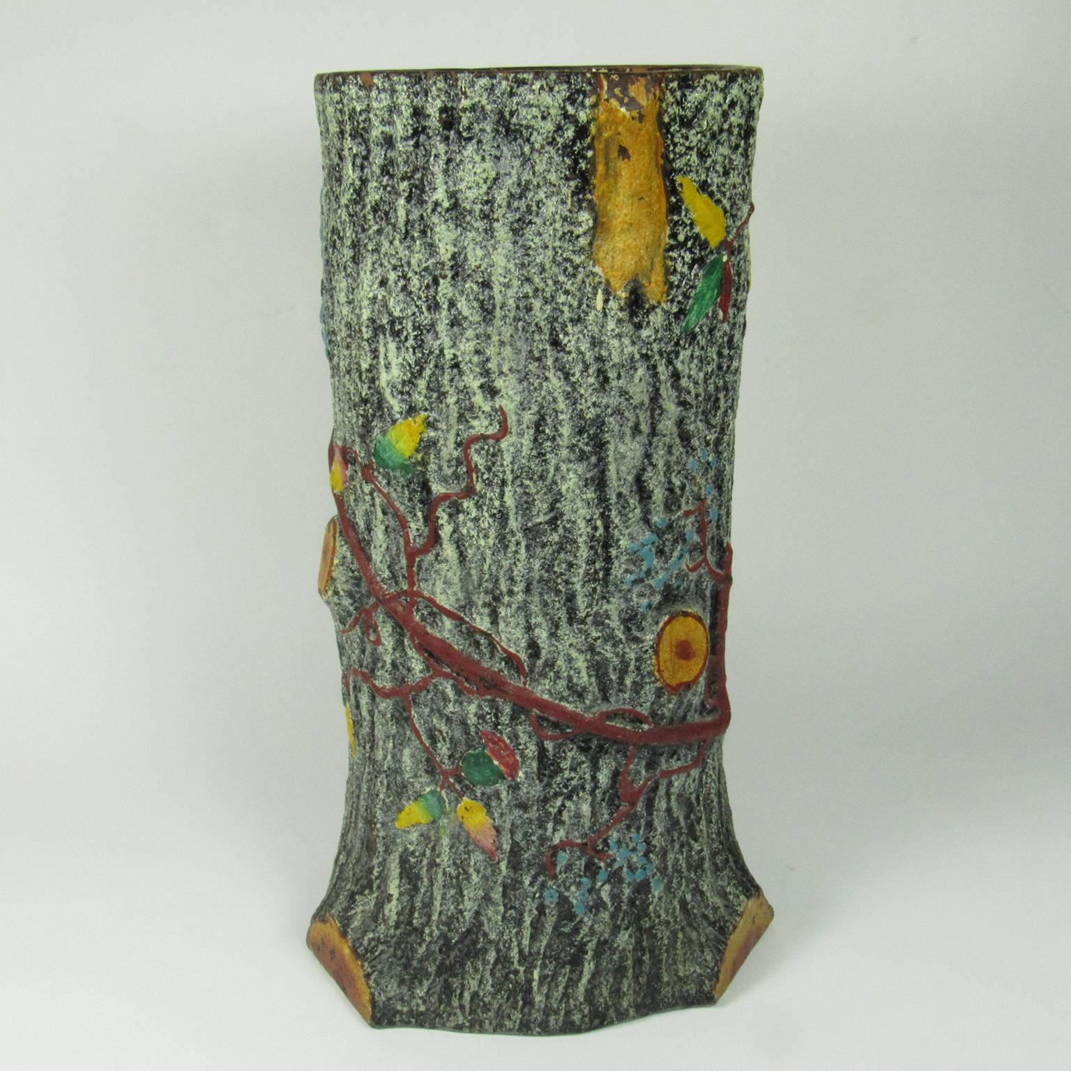 Vintage faux bois ceramic umbrella stand in the form of a tree trunk encrusted with a vine and fall leaves. Measures: Height: 19 in., diameter: 11 in.
Provenance: Joel and Sharon Schwartz collection.