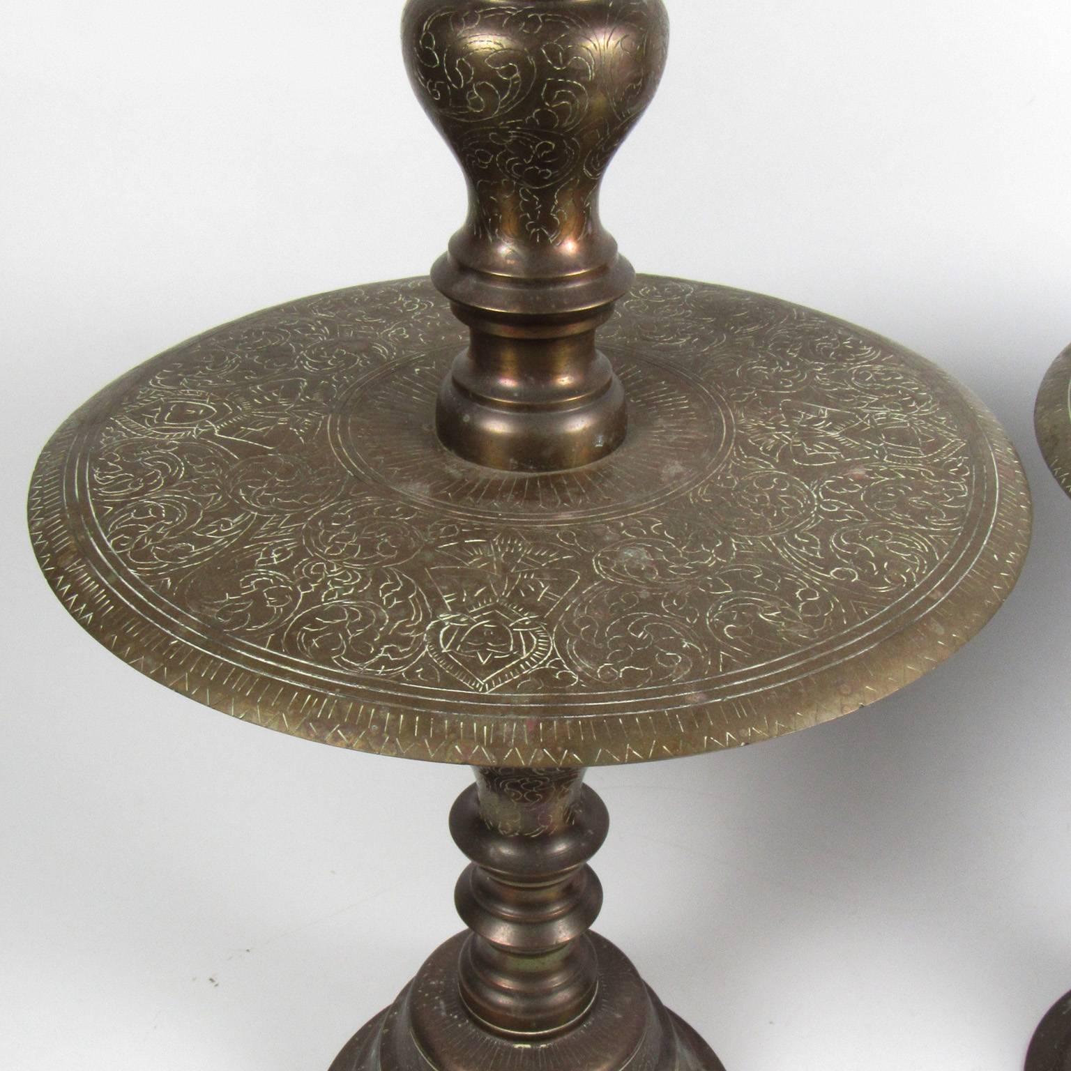 Very large pair of Indian etched brass candlesticks, early 20th century, height: 26 in., diameter: 11 1/2 in.