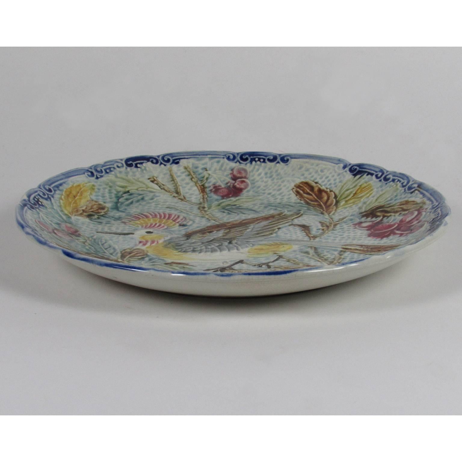 Scalloped edge Majolica Plate with an exotic bird on a branch, possibly of French or German origin. Diameter: 10 1/4 in., height: 1 1/4 in.