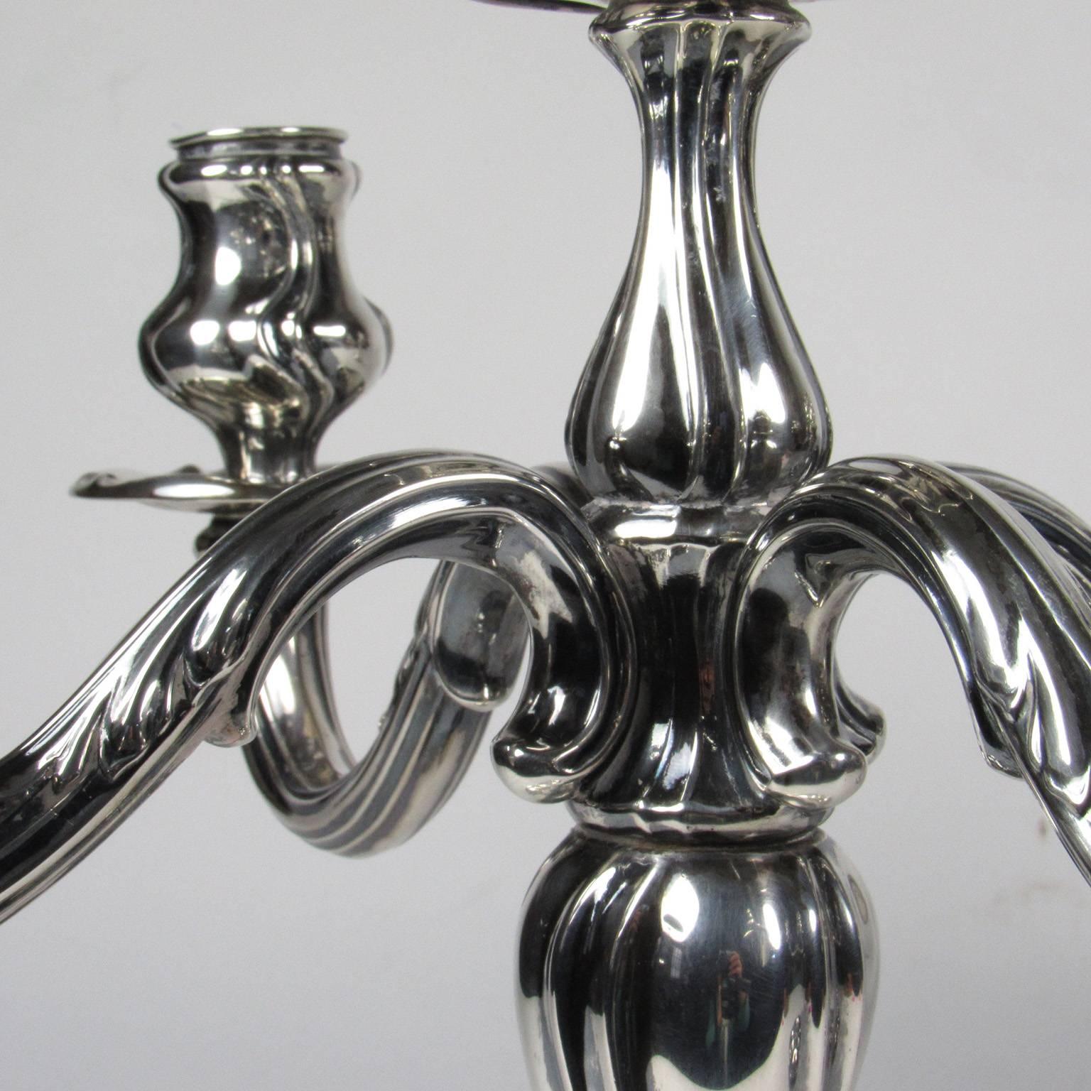 Pair of German 800 silver Art Nouveau five-light candelabra, bearing marks for Otto Wolter and Reichsmark for Germany, after 1886. Approximately 72 ozt. Measures: Height 14 in., diameter 15 in.