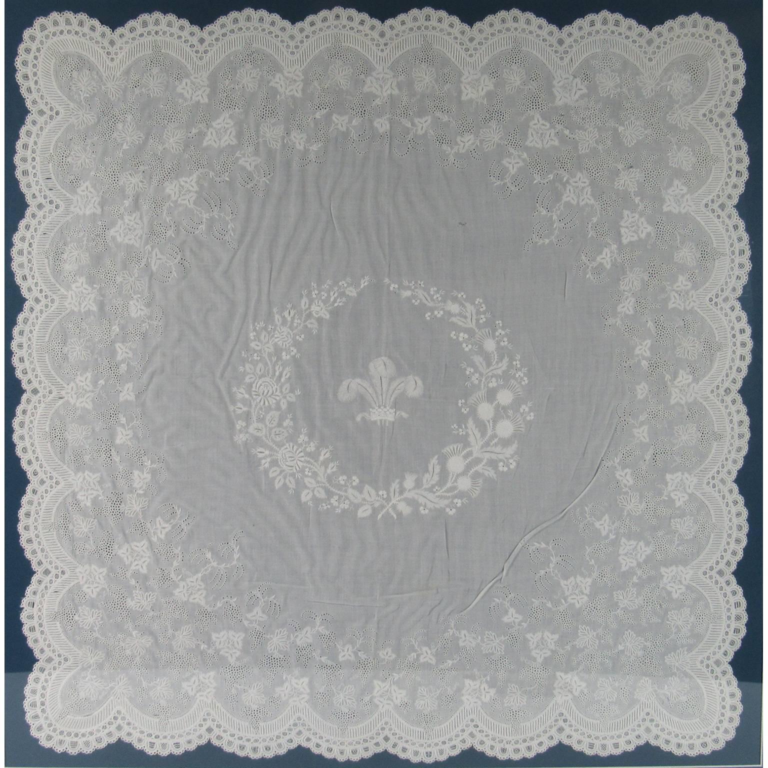 Fine 19th century antique linen embroidered table scarf, likely from Belgium or France. Incredibly detailed with scalloped edges and fleur des lis and floral design in center. Mounted to a blue mat and framed under glass for display. A wonderful