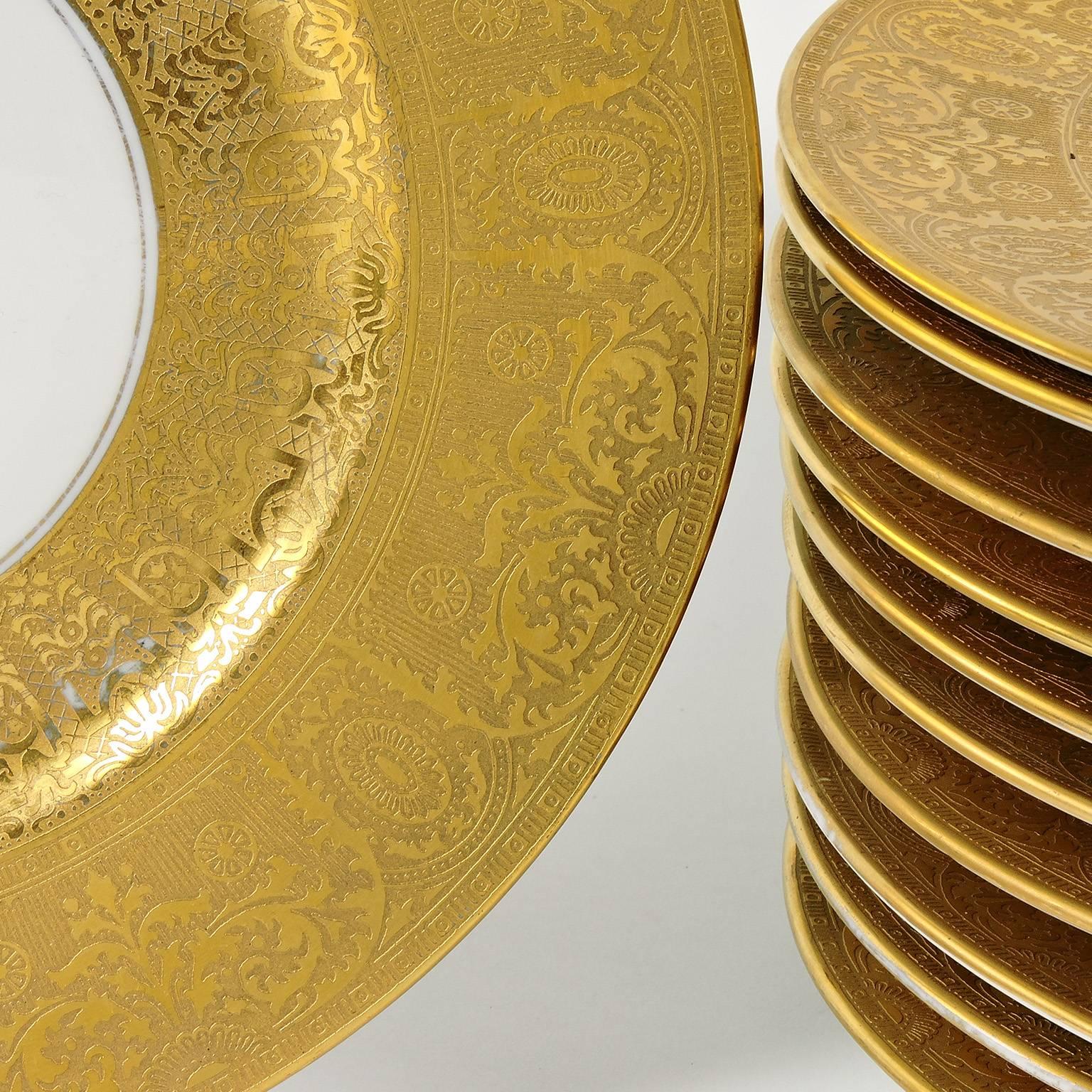 Set of Eleven Heinrich & Co. Selb Bavaria gold rimmed dinner plates, marked 