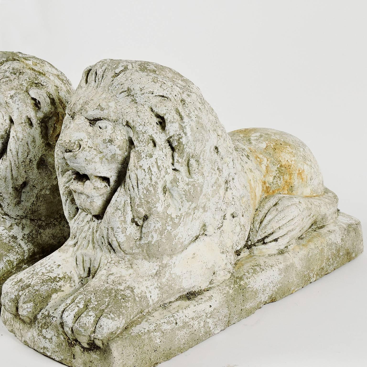 American Pair of White Painted Cast Stone Recumbent Lions, circa 1920