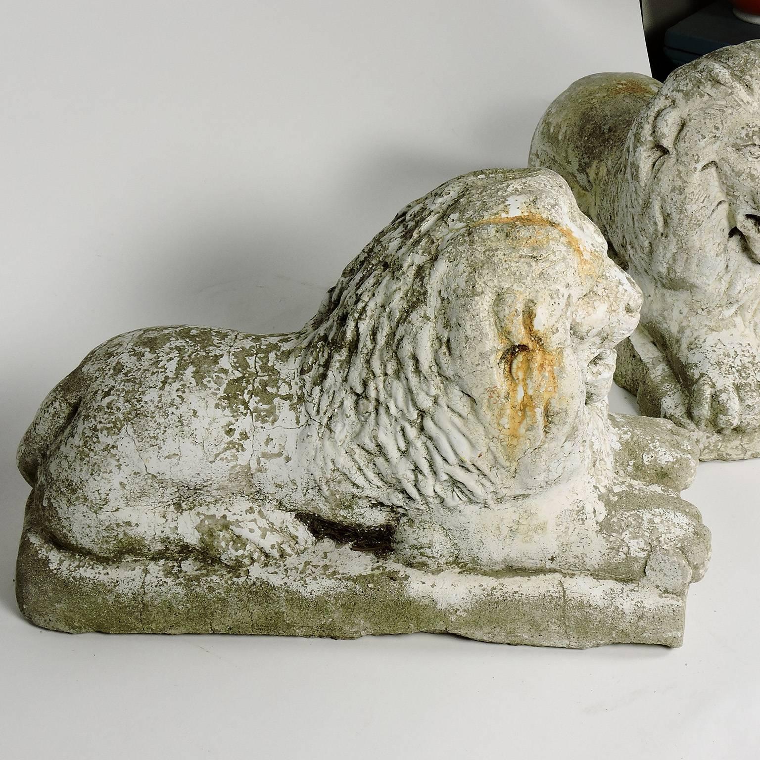 Pair of White Painted Cast Stone Recumbent Lions, circa 1920 In Good Condition In Concord, MA