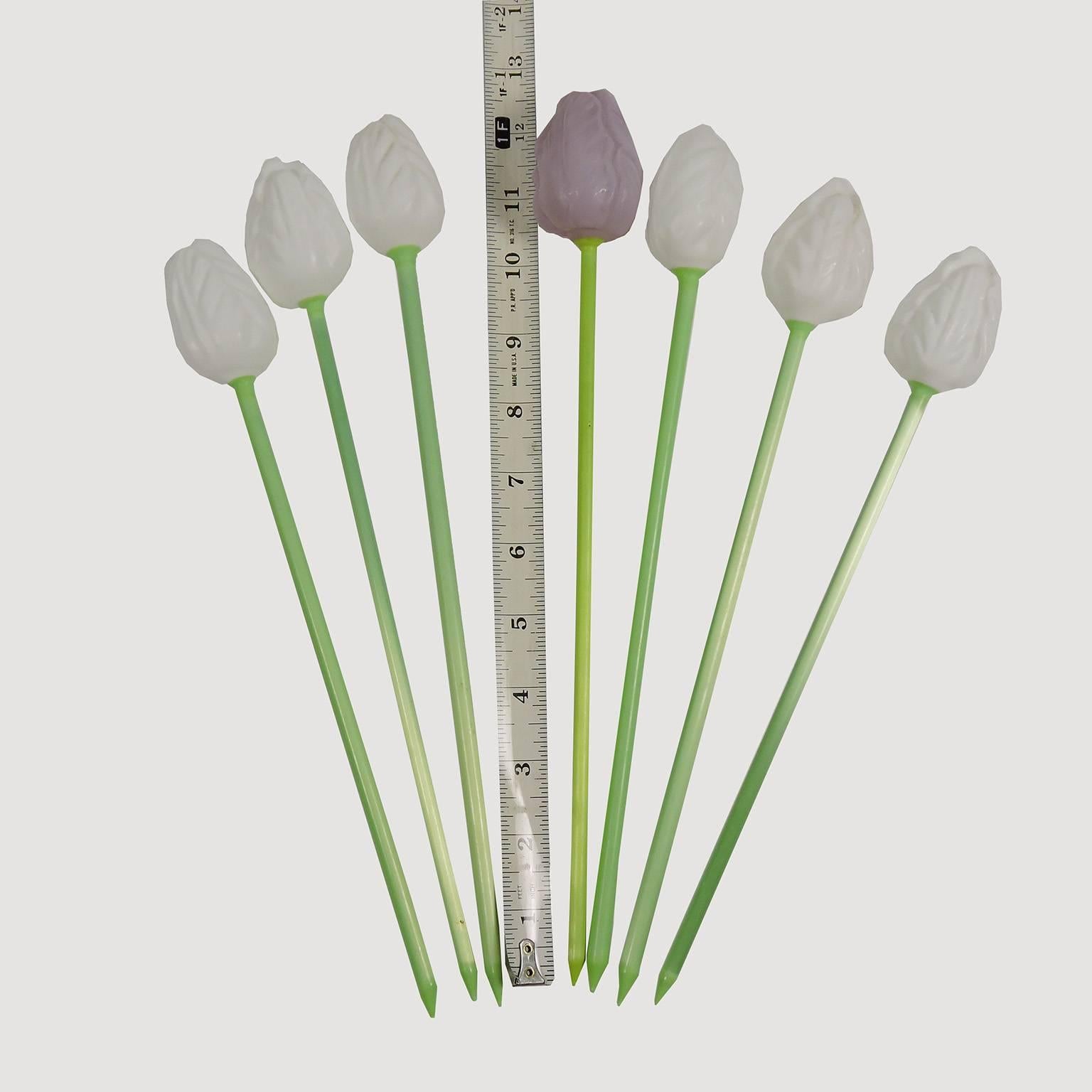 Set of 11 German glass tulips, including eight white, two light purple and one dark purple with green stems. Sizes range from 8 to 12 inches tall.