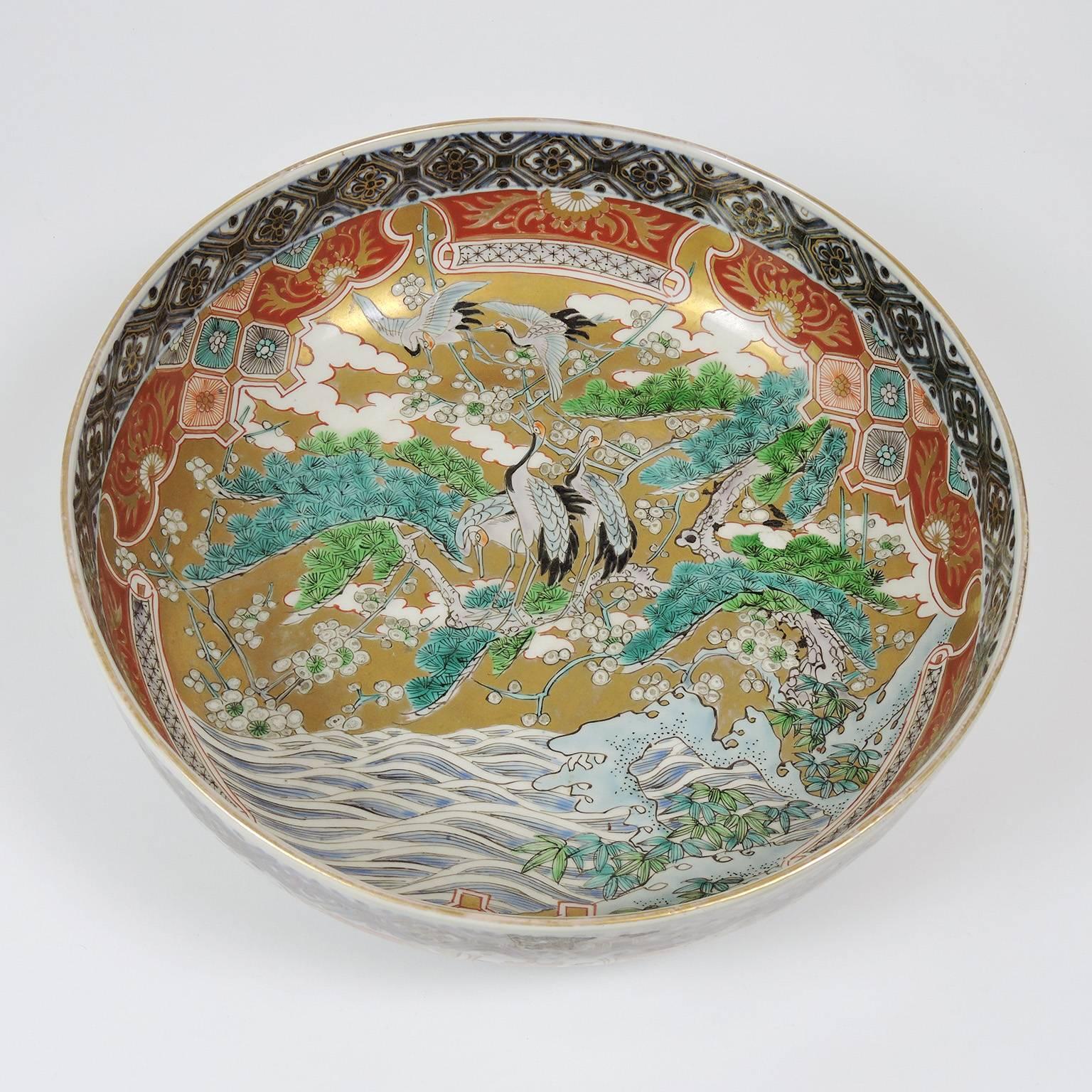 Japanese Kutani porcelain center bowl with crane decoration, late 19th century. 
Measures: Diameter: 12 inches, height: 4 inches.