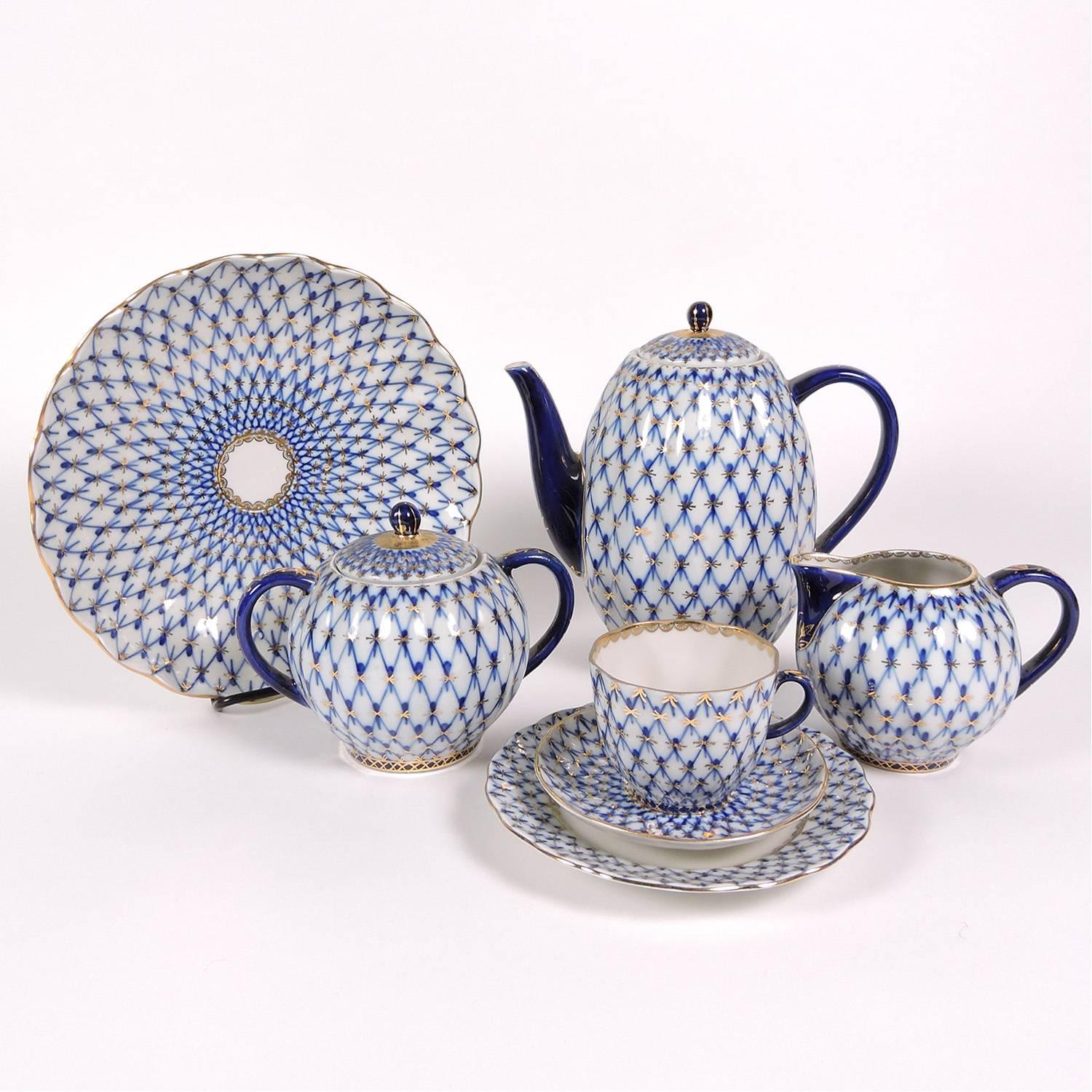 Russian Imperial Lomonosov Cobalt and gilt net design porcelain coffee service for six, 20th century, stamped 