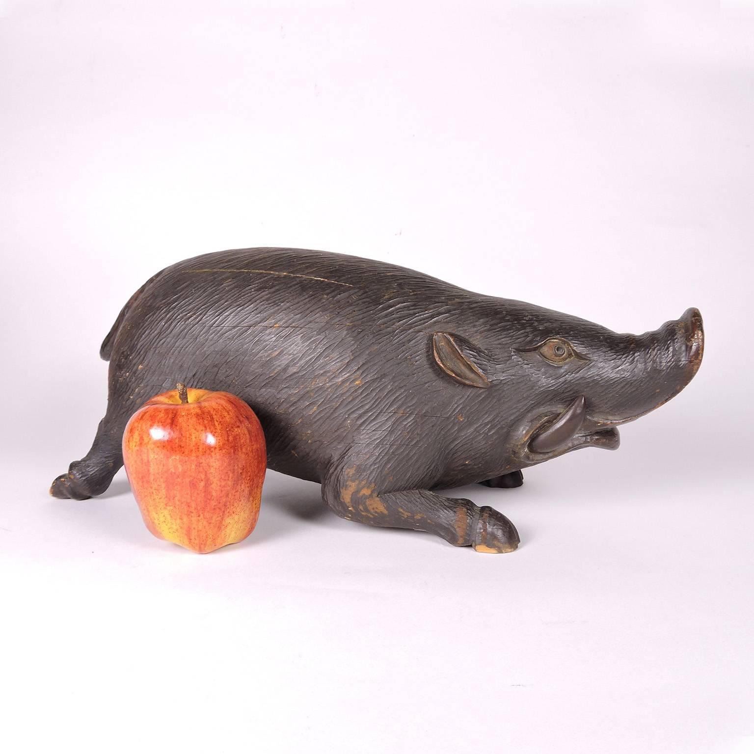 19th century Black Forest carved figure of a boar. Exceptional carving and patina.
Measures: Length 16 in., height 6 3/4 in., width 5 in.