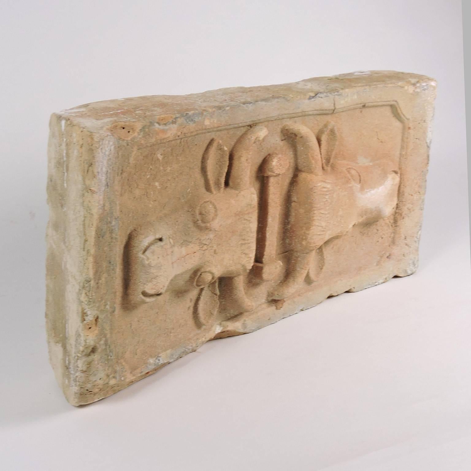 Carved sandstone architectural element with opposing bulls heads, American, 19th century, of slightly bowed form, carved in relief. Super fun and funky.
Dimensions: 8 3/4 x 18 1/2 x 4 1/4 inches. Approx. 20-25 lbs.
