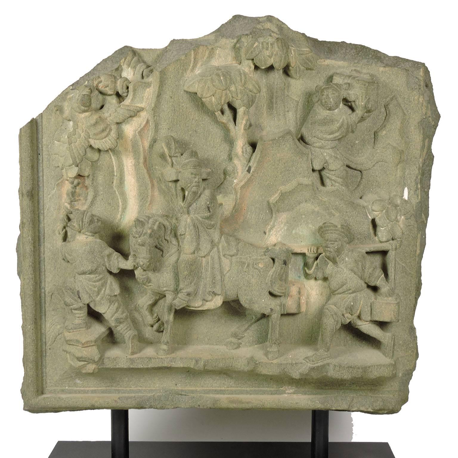 19th century Chinese carved greenstone architectural element, depicting a Chinese official on horseback with figures and bird, mounted on Stand. 
Dimensions: 17 1/4 x 17 1/4 x 4 inches. Overall height: 23 1/4 inches.