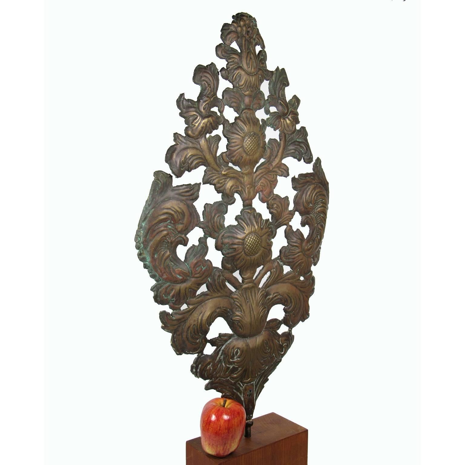 Early to mid-19th century molded and pierced copper architectural decoration, with floral decoration.
Dimensions: 27 x 15 inches.