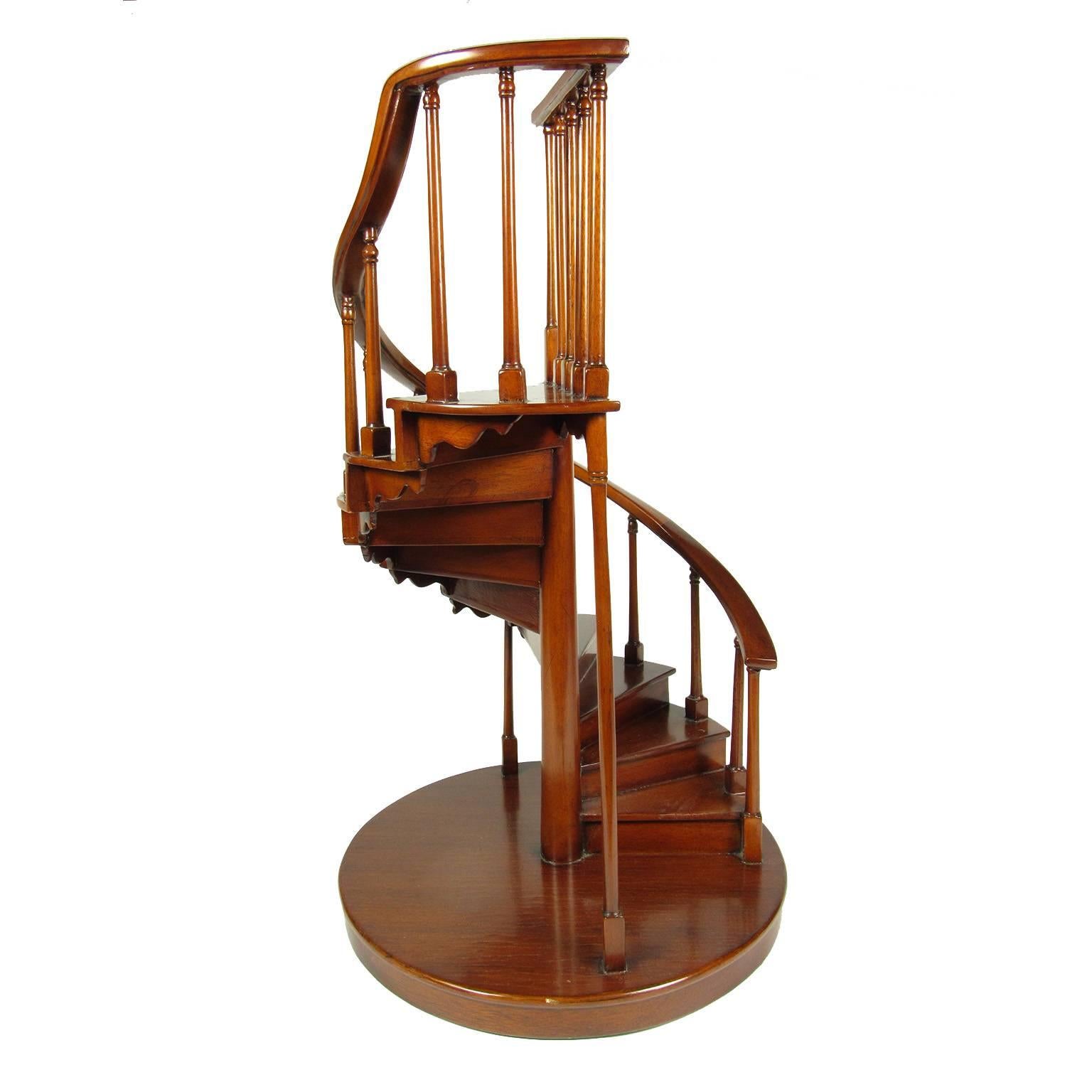 19th century mahogany (or rosewood) spiral staircase model.
Dimensions: 23 3/4 x 14 inches.